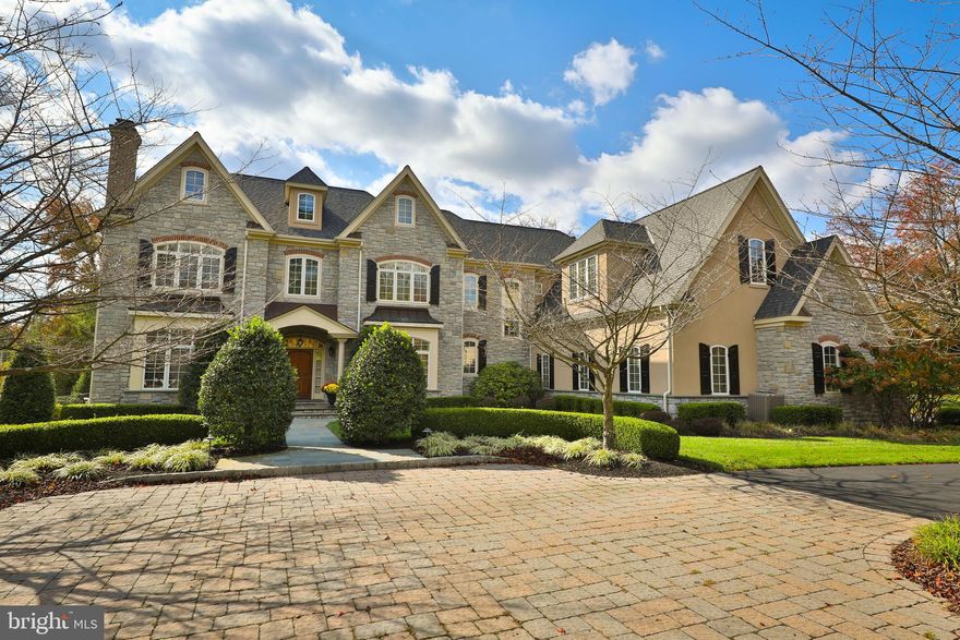 Every so often a perfect home comes on the market and 1011 Walton Rd in Blue Bell is it. Nestled on nearly two manicured acres in a private 3 home gated enclave, this custom 5 bedroom home was built with the finest details throughout.  It is substantial in every way, and you feel it before you even enter the home.  Once you enter though, wow!
Standard in THIS home are on site hardwood floors, 10 ‘ceilings on the main floor, 9’ ceilings on the second, and 8’ ceilings on the 3rd and in the finished lower level, 4 gas fireplaces and dual staircases. The foyer and hallway are finished with custom millwork which continues up the front stairs.  To the left is a handsome paneled office with gas fireplace. Beyond it is the timeless, contemporary living room. The grand dining room to the right of the foyer overlooks the front garden. A butler's pantry with wet bar between the dining room and kitchen helps everything flow. The kitchen will delight your inner chef with Sub-Zero and Viking appliances to help you cook like a pro. There is extensive cabinetry with space to keep everything organized.  The breakfast room is centered between the kitchen, sunroom and family room. The vaulted, windowed sunroom also opens to the patio. The stunning family room is well thought out. A paneled ceiling, built-ins, gas fireplace and extensive wet bar offer everything you need for relaxing quietly or entertaining. Completing the first floor are two powder rooms and closets.
The second floor has 4 en-suite bedrooms.  The Primary Suite is exquisite with tray ceiling, fireplace, large sitting room/office and walk in closets. The main walk-in closet is literally a room, complemented by a dressing area/vanity, and spa-like bathroom with soaking tub, double vanity, and separate walk-in shower. The additional 3 bedrooms all have walk-in closets and full baths. A large laundry room and linen closet complete this level.  The third floor offers a 5th bedroom suite or can be a fun “pajama den”.
The lower level is fully decked out.  It includes a Media Room with state-of-the-art equipment and new seating which transfer with the home. There is a gaming area, full kitchenette/bar and a separate rec room which can easily convert to a home gym. Double doors lead outside.
The backyard is an oasis with a gorgeous bluestone terrace overlooking a pool and spa.  It’s fully enclosed for privacy, though with a 2-acre lot you’re already ensured privacy.
The 3 bay oversized garage is temperature-controlled and has a tiled floor. Your cars will be pampered living here too. A whole house generator provides peace of mind no matter the weather.
The location can’t be beat.  Located near excellent public and private schools, walking trails, shopping, restaurants, and Septa. Easy access to 476,76 and the turnpike. If you drive to the shore or center city this location easily saves you 15 minutes from other parts of the district. This property literally has it all.