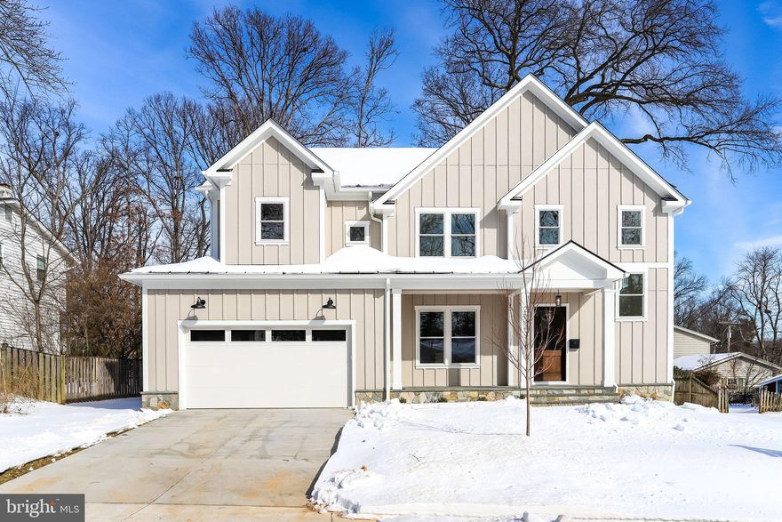 This stunning new construction by Dunhill Builders offers an exceptional opportunity to own a thoughtfully designed home in the sought-after Dunn Loring Woods neighborhood.  In a prime location on a spacious .29-acre lot, this residence boasts over 6,000 square feet of meticulously crafted interior living space across three levels, featuring 5 bedrooms and 5.5 bathrooms.  The exterior is a standout, showcasing a beautifully landscaped yard, a welcoming front porch with elegant trimmed columns and a wood ceiling, a stone water table, and durable Hardie siding. Step inside to find 10-foot ceilings on the main level, wide plank white oak hardwood floors, extensive trim work, and premium Marvin windows, all exuding quality and sophistication.  The main level is designed for both comfort and entertaining. A formal living room and dining room connect seamlessly via a butler’s pantry, complete with cabinetry and an integrated beverage/wine refrigerator. The expansive family room, centered around a sleek gas fireplace, is bathed in natural light from oversized windows overlooking the backyard. Adjacent is the gourmet kitchen, a chef’s dream with custom cabinetry, quartz countertops, a generous island with ample seating, and a sunlit breakfast area with direct access to the rear yard. A private study, which can easily be converted into a first-floor bedroom, completes the main level.  Upstairs, the second level features three generously sized bedrooms, each with walk-in closets and en-suite bathrooms. The luxurious primary suite is a true retreat, offering an oversized bedroom, a sunlit sitting area, tray ceiling, and dual walk-in closets with custom shelving. The spa-like primary bathroom includes double vanities, a soaking tub, and a tiled shower with double shower heads.  The lower level is equally impressive, offering a spacious recreational room with rough-in for a wet bar, an exercise room, ample storage, and a private bedroom with an en-suite bathroom—perfect for guests, a home office, or extended family.  Don’t miss the chance to make this exceptional property your forever home. Call today for more details!