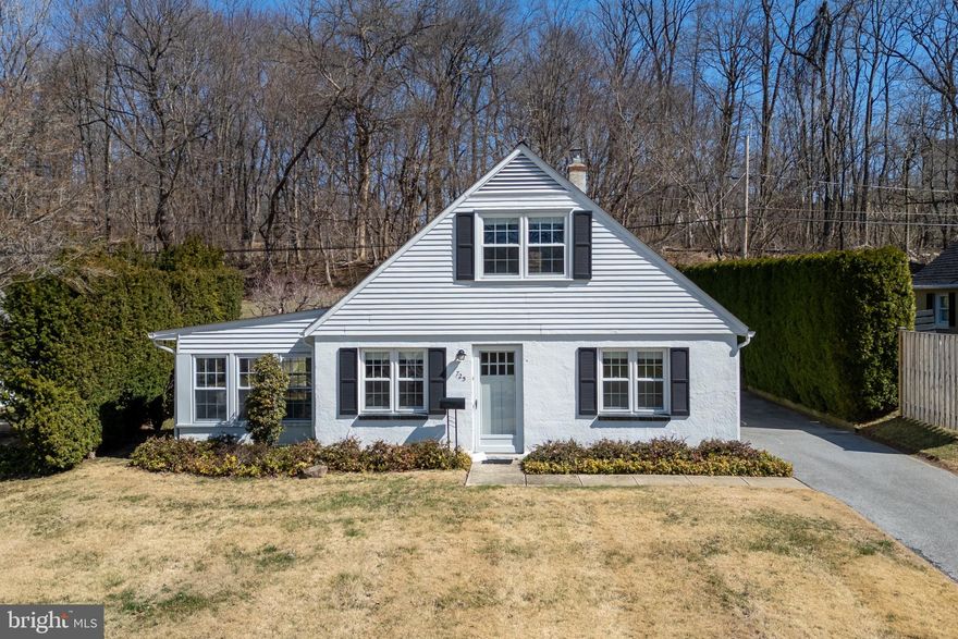 Charming Cape Cod with a 1st floor bedroom! 725 Hillside Dr is a sun-filled, cottage-like home which offers an incredibly versatile floorplan, a private home site, and a convenient location, all in one. There is formal living and dining, an efficiently designed, cute-as-a-button kitchen, a dedicated home office with built-in cabinetry, and the 2nd floor boasts 2 spacious bedrooms with hardwood flooring. Beautiful natural light throughout blends your indoor/outdoor living spaces. A set of French doors leads to the most enticing 3-season room which in turn leads to outside to a stone patio. What lovely spaces to relax or entertain! The spacious backyard features a decorative stone wall and offers excellent privacy with evergreen hedges and a privacy fence, as well as a buffer of mature trees that backs onto permanently undeveloped grounds in the rear. There is also a convenient storage building at the back of the house with electric and a workbench. Plus, 725 Hillside Dr also features central air, a private driveway for off-street parking, a full 1st floor bathroom, and there’s a convenient utility/laundry room on the first floor with outdoor access to the yard. Enjoy a 10-minute stroll to Marshall Square Park and you’ll also have the Borough’s shops and restaurants within easy reach. Request a personal tour today!