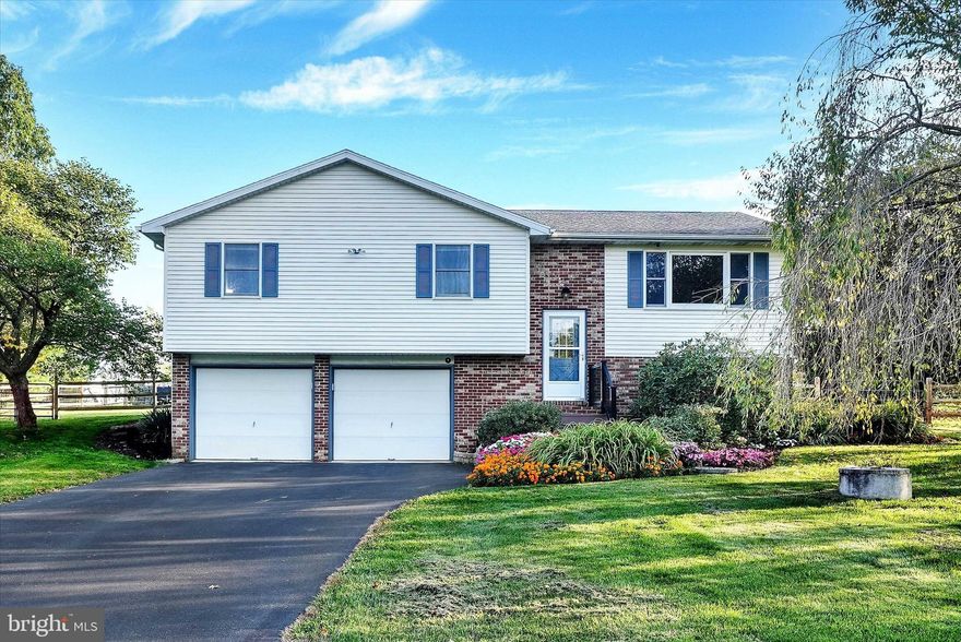 This stunning home is a must see. Located in Hamburg schools. Situated in a nice country setting on just under a 1 acre lot.. Offering 3 bedrooms, 2.5 bathrooms and a 2 car attached garage. Features a semi open concept main floor.  The living room features a large bay window, and is open to the kitchen with granite counter tops and tile floor. The kitchen inclusions are the refrigerator, double oven glass top range, microwave, and 4 saddle stools for the eat-in kitchen. There is a fully fenced in yard, a spacious trex deck as well as a 12x24 shed with a garage door.  The lower level is finished and houses a custom granite wet bar and family room. The lower level walks out to the garage. This home has been beautifully updated and well maintained.  The two full baths were newly updated in 2022 with tile floors and granite counter tops. The lower level and half bath were finished in 2021. The half bath has a granite counter top with a full size stainless steel sink to double as a laundry and/or shop sink.  The oversized garage houses the new WiFi water heater (installed 2022), new well pressure tank (installed 2022), new air handler (installed 2021), and WiFi garage door openers (installed 2022).  The septic was redone in 2018..  All the plumbing was replaced in 2021 and is PEX throughout!   The attic stairs were also installed to make storage a breeze! Schedule your showing today!!