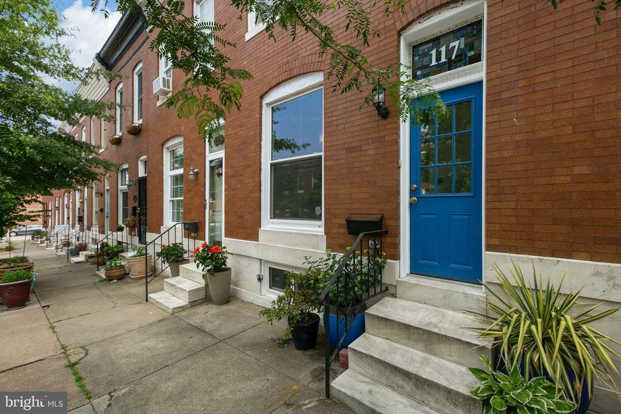 Beautiful all brick row home with tons of updates! Fresh paint throughout.   Wide open floor plan with tall ceilings on the first floor, large windows, gas fireplace, granite countertops, SS appliances and large courtyard in the rear.   Totally customized and renovated lower level with bedroom, full luxury bathroom with frameless glass shower, and additional living room or office area.   The upper level boasts 2 nice sized bedrooms with a full bathroom in the hallway.  This is a highly functional floor plan with nice updates in a great location!