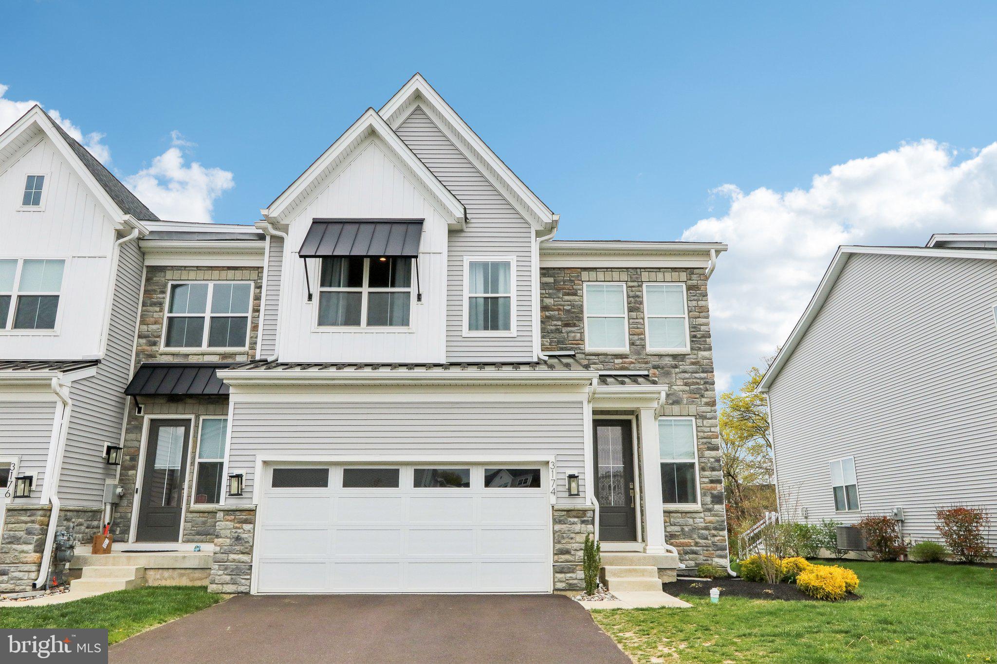 Welcome to this stunning 3-year-young Delan Elite end unit carriage-style townhome in the coveted Reserve at Emerson Farm by Toll Brothers. With high-end builder upgrades throughout and a beautifully crafted stone front façade, this home combines timeless style with modern luxury and is situated on a premium lot that backs up to open space.
Step inside to a dramatic two-story foyer bathed in natural light, showcasing wide-plank neutral hardwood flooring that flows seamlessly throughout the main level. As an end unit, this home enjoys abundant sunlight from extra windows, enhancing the airy, open-concept design.
The heart of the home is the expanded great room, a premium builder upgrade, ideal for everyday living and entertaining. The gourmet kitchen is a chef’s dream—featuring a deep island with seating, upgraded Quartz countertops, white subway tile backsplash, a gas cooktop, and classic white cabinetry offering exceptional storage and prep space. A walk-in pantry, located conveniently near the garage entry, adds even more functionality.
Upstairs, a versatile loft area provides the perfect spot for a home office, playroom, or media lounge. The luxurious primary suite is a true retreat, complete with expansive windows, a walk-in closet with direct access to the second-floor laundry, and a spa-inspired bath featuring a double vanity, oversized shower, and modern wood finishes in a calming neutral palette. Two additional bedrooms complete the second level—one with an ensuite bath, and the other adjacent to a hall bath with a tub.
The unfinished basement, already plumbed for a bathroom, offers endless possibilities for added living space or storage.
With a 2-car garage, premium location within the community, and the quality and craftsmanship synonymous with Toll Brothers, this home is an exceptional opportunity to own in one of the area’s most desirable neighborhoods.
This home feeds to Mill Creek Elementary School, which will be one of the few elementary schools in Central Bucks School District to start full-day kindergarten in the fall of 2025!