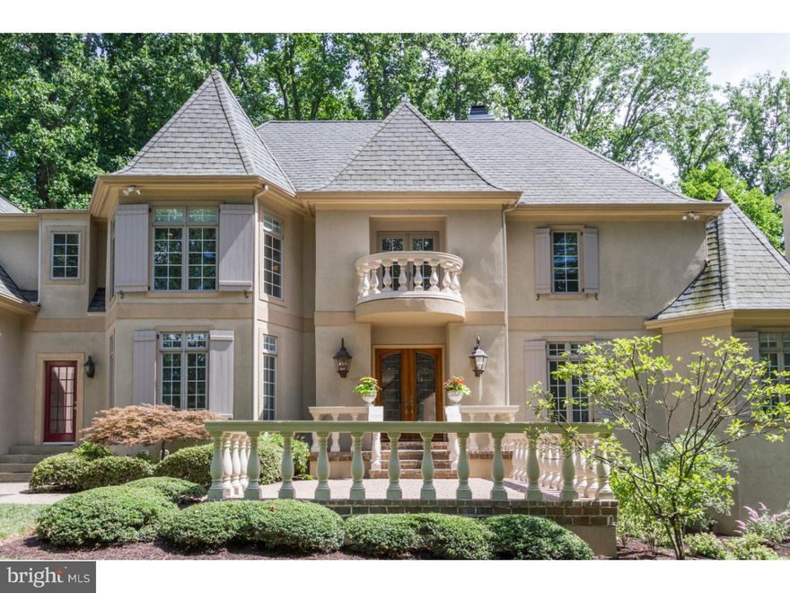 Nestled in the heart of award-winning Radnor Township School District, this stunning home situated on 1.23 acres, marries charm, a serene setting and convenience of location. This estate is extensively enjoyed for its all occasion entertaining both indoor and out. Tucked away down a long private driveway, the location is unparalleled. You'll enjoy your own access to the Radnor trails, natural woods, a dip in the pool after your morning run and the sounds of nature that will entertain you while you sip your first cup of coffee. The home's layout takes full advantage of the natural surroundings that allow enjoyment of sunlight and picturesque views of the woods that surround it. A marble vestibule with a sweeping staircase to the upper floors welcomes you. A sun-filled living/sitting room features a gas, marble fireplace and hardwood floors. The heart of this home is the family room that overlooks the eat-in gourmet kitchen with center island seating. The family room also offers hardwood floors, multiple sets of French doors leading to an oversized deck and pool and a dramatic double-sided, stone fireplace that punctuates the space. Upstairs you'll find a master with grand views of the surrounding property and pool from a wall of windows and  sunrise window, gas fireplace and en suite bath with an oversized shower and jetted bathtub. Four other bedrooms and two full baths complete the 2nd floor. A huge day-lit basement includes mirrored exercise room, game room, media section, wet bar, full bath and access to the pool. Other features include, a four-car garage, security system, third floor bonus room and recently painted throughout. Come enjoy the private serenity of this bucolic setting surrounded by professionally landscaped and manicured lawns, while still having the convenience and access to all major highways, the train to Center City or NYC, King of Prussia Mall and the many shops and restaurants of downtown Wayne.