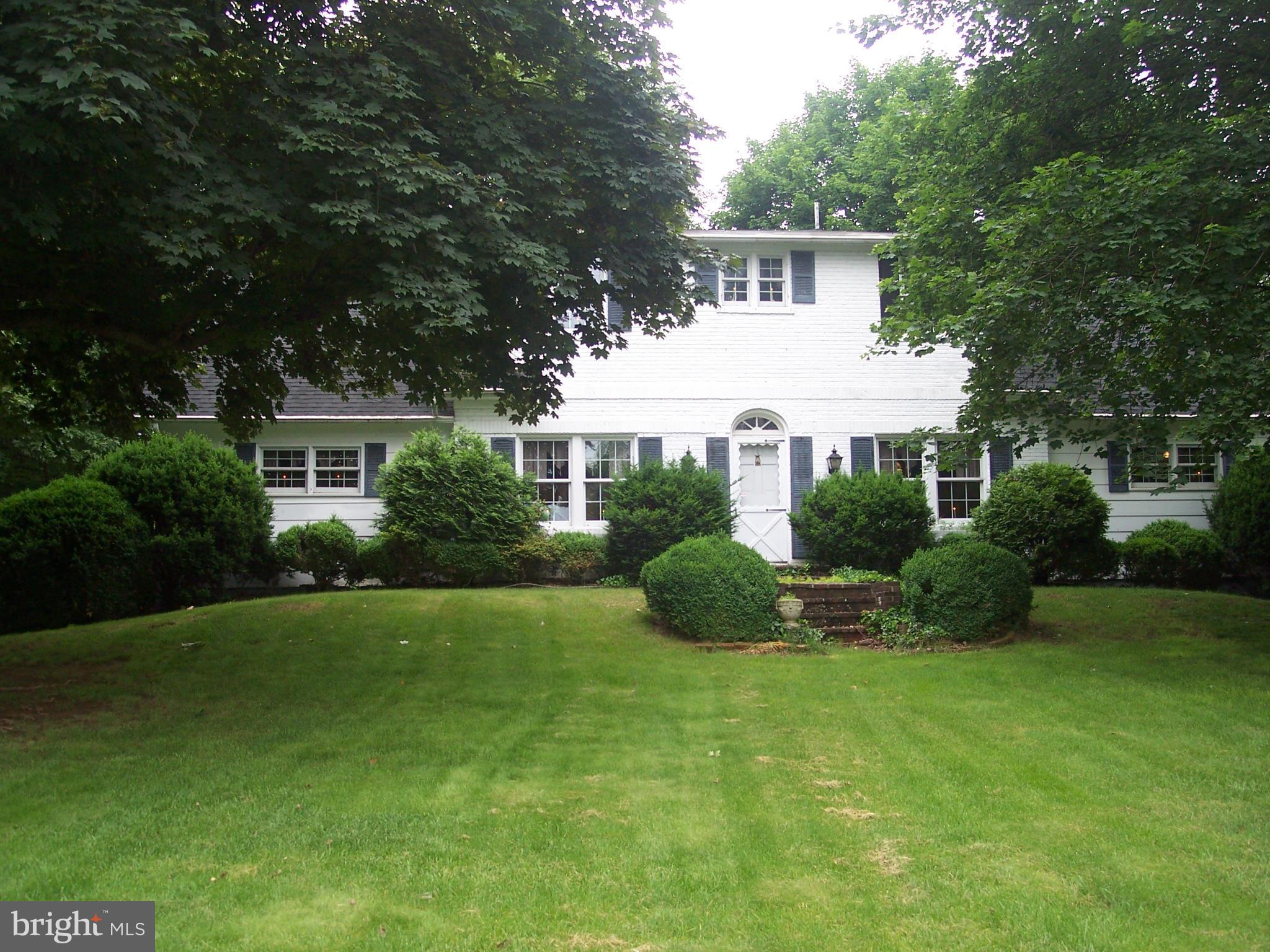 PRESTIGIOUS (RED HILL) Historic Brick Colonial presents itself with 4 bedrooms-3 baths-multiple wood-burning fireplaces. The park like landscaped grounds with it's residents' pool & pool house is yours to update to your pleasure. This unique property has been featured in multiple exclusive HOMES & GARDEN TOURS in Martinsburg. NOW offered at $279,900.....