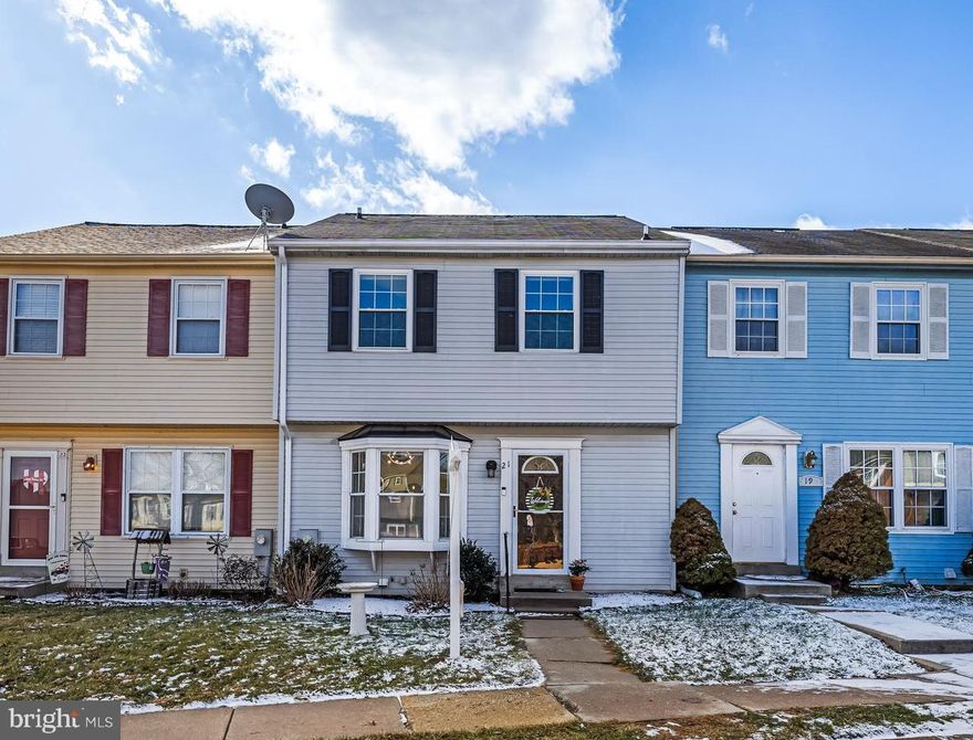 Welcome to 21 Sandstone Court, a bright and comfortable three‑bedroom, three‑bath home in the heart of Nottingham. Completely renovated in 2021, this home feels fresh, modern, and move‑in ready from the moment you step inside. The main level offers an easy flow for everyday living, featuring luxury vinyl plank flooring installed in 2021 and a spacious kitchen upgraded with quartz countertops, a stylish backsplash, and 42‑inch cabinets. A full bathroom on this level, renovated in 2021, adds everyday convenience.

Upstairs, all three bedrooms are together on one level, including a well‑appointed primary suite with an updated en suite bath showcasing custom‑made cabinetry, a double‑sink vanity, and a walk‑in closet. All three bathrooms were fully renovated in 2021, creating a cohesive, modern feel throughout the home. The lower level provides flexible space for work, play, or guests and opens to a walk‑out patio through a beveled glass sliding door that fills the space with natural light.

The washer and dryer were replaced in 2023,  and the HVAC system was newly installed in 2024 for added peace of mind. Outside, the yard backs to mature trees and offers a scenic view with plenty of local wildlife - an inviting, peaceful backdrop for morning coffee or unwinding at the end of the day. Two assigned parking spaces add everyday convenience. All of this is just minutes from the beltway, gyms, restaurants, grocery stores, bars, and every amenity you could need, making this home the perfect blend of comfort, updates, and location.