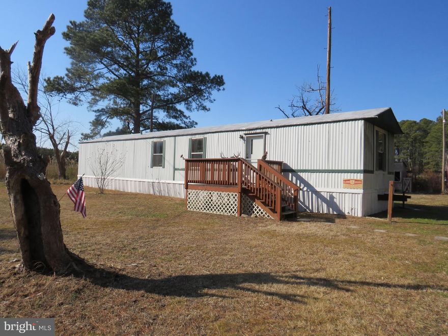 Mobile home in good condition with two bedrooms and two baths, one at each end of the home.  Utility room with rear door.  There are several outbuildings, open pole shed, enclosed shed with overhead door, old chicken coop and fenced run area, and insulated truck body converted to storage.  But what seals the deal is the location, open meadow land bordered by ditches and wooded area is a hunter's dream.  Deer and turkey abound, and if you like watching other wildlife and birds, this is a haven for wildlife.  Property is zoned A-agriculture.  It is in AS IS condition.