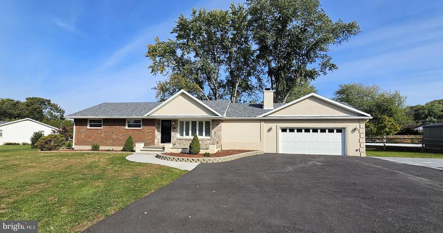 A Retreat of Refined Comfort in Saucon Country Estates — Coopersburg, PA
Welcome to a residence where thoughtful updates meet spacious single-level living. This fully re-imagined 3-bedroom, 1.5-bath home sits on almost one acre in the coveted Saucon Country Estates community, offering an effortless blend of comfort, style, and open design. 
From the moment you arrive, step into a beautifully renovated open floor plan designed living area. Gleaming wide‐plank flooring flows through the living and dining areas into a designer kitchen, complete with crisp white cabinetry, a large island, and modern fixtures — perfect for day-to-day living or hosting friends.
The sunny dining space opens out toward the yard, allowing indoor/outdoor living to merge seamlessly. Outdoors, discover a lush, level lawn and the delightful bonus of a private in-ground pool  — an inviting setting for summer gatherings, tranquil mornings, or simply stretching out in the fresh air. 
Back inside, the bedrooms are generously scaled. The primary suite offers a quiet retreat, with a serene palette and easy access to the beautifully updated bath. Every corner of the home reflects care – from custom lighting to smooth transitions in flooring to the fresh, light-filled spaces throughout. The fully finished lower level adds expansive room for a family lounge, play area or home gym, completing a turnkey package for the modern homeowner.
Situated in the reputable Southern Lehigh School District and in the desirable Upper Saucon Township, this home captures the best of tranquil suburban living while keeping you close to amenities and the Lehigh Valley’s vibrant lifestyle