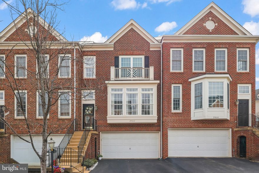 ***OFFER DEADLINE:  MONDAY, MARCH 30TH AT 10:00AM***This beautiful 3‑level townhome in the sought‑after Stone Ridge community offers over 2,700 square feet of bright, open living; more space than many detached homes! Sunlight pours through the main‑level floor‑to‑ceiling windows into a welcoming living room with built‑ins. The space flows seamlessly across hardwood flooring throughout the entire main level into the dining area accented by crown molding, chair rails, and recessed lighting. The eat‑in kitchen feels fresh and updated with 42" oak cabinetry, granite countertops, stainless steel appliances, gas cooking, abundant storage, and a bump‑out that opens to a private balcony overlooking the trees. Upstairs, the oversized primary suite features a walk‑in closet, a large sitting area with views of the treed community space, and an ensuite bath with double vanity, soaking tub, and glass‑framed shower. Completing the upper level are two additional spacious bedrooms, a hall bath with double vanity, and a laundry closet with full‑sized washer and dryer. As you head down to the lower level, a convenient half bath sits on the landing. The lower level expands your living space with a generous rec room, full bath, sitting area with gas fireplace, and a conveying Murphy bed, plus access to the 2‑car garage. Step outside to a private backyard with a stamped concrete patio, garden space, and blooming plantings. Major updates include hot water heater (2022), HVAC with air scrubber and humidifier (2020), and roof (2017). Enjoy incredible community amenities including three nearby pools (closest is Nettle Mill Pool, 0.2 mi), Stone Ridge clubhouse, fitness center, tot lots, Byrne Ridge Park, and fun neighborhood events like Wizard‑inspired Bingo Night, Summer Kickoff, and community yard sales. Convenient to Stone Ridge II Park & Ride, Tall Cedars Pwy, Gum Springs Rd, Northstar Blvd, Rt 50, Rt 28 and Dulles Airport. Close to shops, restaurants, and amenities such as Harris Teeter, Gum Springs Library, Stone Springs Hospital, Walmart, Home Depot, Starbucks, and Costco.
