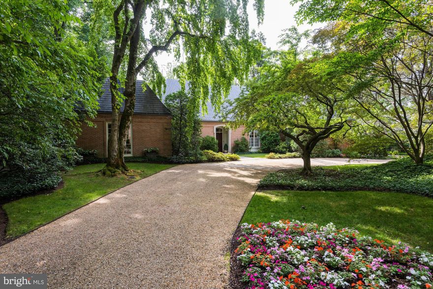 One of the prettiest properties to come to market in recent memory, this elegant and understated home sits far back from Cedar Parkway with a dramatic approach through the lush front grounds of a corner double lot which encompasses over 3/4 of an acre. Custom-built brick Georgian style home complete with hipped slate roof was constructed with exacting quality standards and bespoke details.