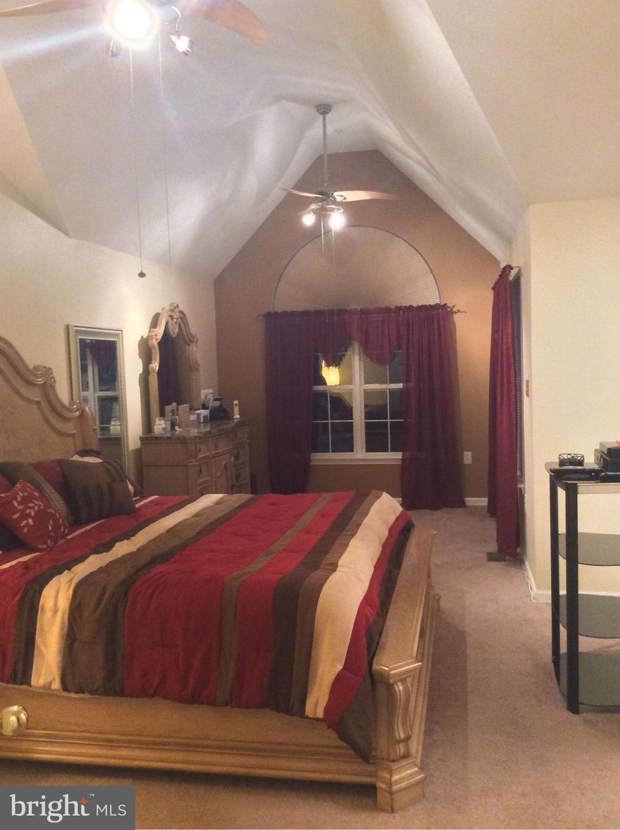 Immaculate 3 Bdrm, 2.5 bath townhome that backs to the woods. New cherry hardwood floors on the first floor, 12 foot rear bump out on all 3 levels & plenty of storage.  Eat in kitchen with deck. Master bedroom with sitting area and newly renovated master bathroom.  New roof. Basement has rough in for full bath and exercise room/4th bedroom. 2 assigned parking space, tot lot and community pool.