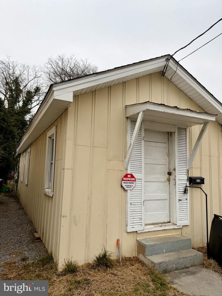 OPPORTUNITY is knocking!  This small and simple house could become an investment property, starter home, downsizing home, or single level living home for someone.  With a smaller footprint, renovations would be minimal but have a huge impact.  A major hidden benefit while living in town is the off street parking with a large driveway behind the home. OWNER FINANCING AVAILABLE.