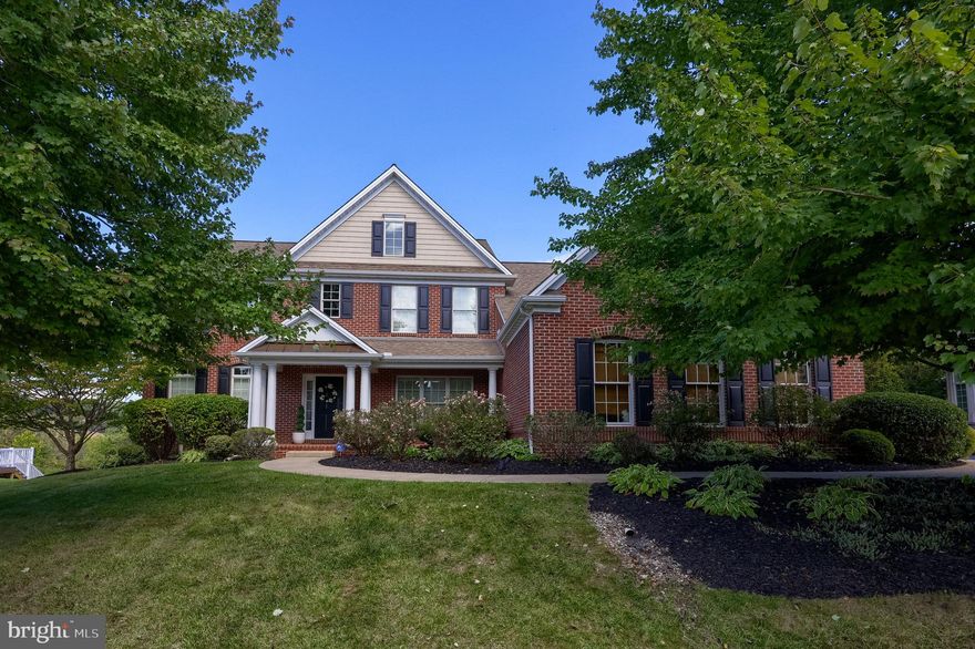 WOW! Over 5,000 finished square feet in the Dallastown School District! This stunning home features a fully finished lower level with a wet bar, a three-car garage, and an incredible outdoor entertaining space.
Step inside to find a beautifully designed interior with luxury vinyl plank flooring throughout. Off the foyer, you’ll discover a formal living room and a private office, perfect for working from home. At the heart of the home is the open kitchen and family room. The kitchen boasts sleek, modern appliances, quartz countertops, and a bright breakfast area. The family room is highlighted by a wall of windows that allows plenty of natural light. A convenient laundry room and powder room complete the main level. Upstairs, the spacious primary suite offers a walk-in closet and a luxurious bath featuring a soaking tub, walk-in shower, and dual vanities. You’ll also find a guest bedroom with a private en-suite, two additional bedrooms with a shared Jack & Jill bath, and a versatile loft area. The finished lower level expands your living options with a family room, wet bar, pool table, and half bath—perfect for entertaining. A playroom and a fifth bedroom with a walk-in closet and en-suite bath make this space ideal for overnight guests or extended stays.