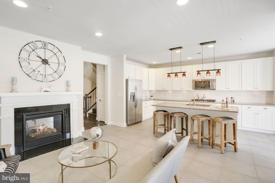 ** Seller will review offers as they arrive and NO Rent back needed- move in ASAP!!**
THE LARGEST 102 Townhome to hit the market all year in Potomac Yard, and one of the few that you can walk 5 mins to the metro station today  (10 min walk to Braddock Metro!!)!   Enter through your private front entryway foyer or pull into the brick paved driveway into your 1 car garage you'll find 9' ceilings throughout your  3 bed,  2.5 bath  luxury town home that consists of 2,917 sqft  of sophisticated living space! The classic elegance and awe-inspiring views atop your penthouse suite will end your house hunt today!  Main level opens up to expansive living room/dining room w/double sided fire place and new HW flooring, leading to a kitchen that allows you to channel your inner chef skills w/elongated island fit to seat 4barstools, under cabinet lighting, SS appliances,  contemporary pendant lighting, and large chefs pantry .  Your guest can relax & cozy up to the fireplace in the adjacent family room while you curate their favorite dishes! Take a seat outside on the covered balcony conveniently located off the kitchen and enjoy your morning coffee or sunset. The top floor offers your dream primary bedroom with tons of natural light and space for all your larger furniture, not to mention  has THE huge custom-built walk in closet that you've always wanted! Primary en-suite comes with private commode, oversized walk in shower , dual vanities, and additional built in cabinets for all your linens! Laundry is a breeze as the  laundry room is conveniently nestled in hall between all 3 bedrooms ! The additional 2 bedrooms are also ample in size, and much larger than anything you will find in comparable homes w/in a 20 mi radius!  Looking for walkability?? YOU FOUND IT!!  All within less than 10 mins, you will be able to walk to: Braddock Metro Station , Potomac Yard Trails, Swings Coffee Shop, Dog Park at Eugene Simpson Stadium Park / sports fields, Monroe Ave dog park, Del ray shopping and dining. Frequent flier? Reagan National Airport is less than a 10 min drive away! As is Old Town Alexandria, Arlington, and  DC!   Truly a commuter's dream! Exciting new developments are underway making this one of the BEST investments you could ever make! Potomac Yard Metro (yellow and blue lines) expected to reach completion in 2022, Amazon HQ2 , Virginia Tech Innovation Campus w/proposed retail spaces, are all in progress and arriving to completion but in just a few years! Welcome Home to 1308 Main Line Blvd #102!  Make your appointment today before this gem is scooped up by one very lucky buyer! You Have Arrived!