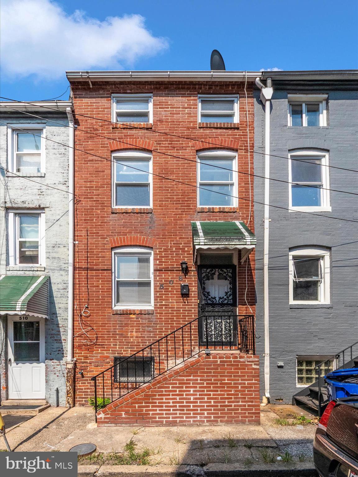 **Listing Description:**
Welcome to this charming row home in the heart of Pigtown, just minutes from Baltimore's Inner Harbor, local colleges, and the stadiums! With 4 bedrooms and 3 full bathrooms—one on each level including a finished basement—this home offers flexible living space ideal for both homeowners and investors.
Recently updated with fresh paint and stylish flooring, the home blends modern touches with original character, featuring exposed brick walls and a spiral staircase that adds a unique architectural flair. Enjoy outdoor living in the private, fenced-in rear patio—perfect for entertaining or relaxing. Whether you're looking for a comfortable primary residence or a high-potential rental property, this home checks all the boxes. Don’t miss your opportunity to own a piece of vibrant, growing Pigtown!