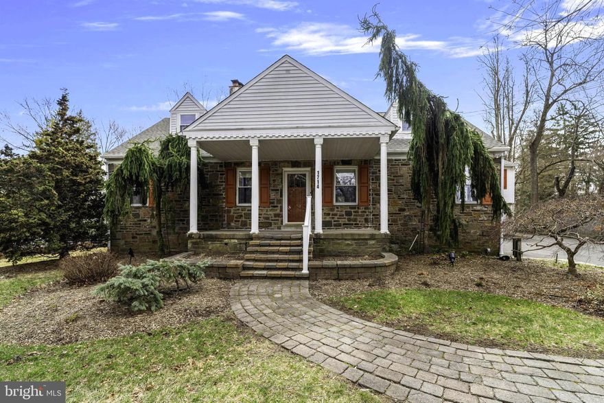 Welcome to 1714 E. Butler. This beautiful stone cape features 4 beds and 2 full baths in the primary and a 1 bed, 1-bath detached guest suite with a private entrance. 1714 also features a brand-new roof and skylights (March of 2025) and has been updated throughout. This property is an amazing escape in suburbia, with ample space in the home and on the grounds,  allowing you to create your private oasis. 1714 features a large first-floor primary bedroom with a spectacular primary bath.  The  2nd bath on the main floor is also full.  This home is truly stunning from the time you pull into the expansive driveway, leading to a full two-car detached garage with a guest suite above. Stroll the grounds, planted with just the right amount of shrubs and flowers to be appealing and quite manageable. The front stone porch is welcoming and shows character and a hint of the extremely well-built house that is before you. Stepping into the living room will reveal the open concept one desires. The hardwood floors glow from the abundant natural light that soaks through the ample windows. This set the stage for a beautiful brick, natural gas fireplace with a mantel and hearth, with the renovated kitchen and breakfast room just beyond. The layout flows throughout all the rooms, including the full dining room just off the living room and adjacent to the kitchen for convenience. Custom backsplash, granite counters, recessed lighting and state-of-the-art appliances, including a trash compactor, are sure to make you a very happy chef. A side entry door offers another way inside directly from the driveway which can accommodate over 10 cars for ease of parking. In the hallway is an updated bathroom with double basins, heat lamp, a laundry chute, and opposite that is a unique spiral staircase that leads to the second floor, tucked away in a nook. Farther down the hall is the primary bedroom with three double closets that can provide ample closet space. The primary bathroom was created in 2017 and has an oversized frameless shower, tiled  floor to the ceiling, double basins, a granite counter, plus recessed lighting. Through the breakfast room’s French door is a wonderful Trex two-tier deck with a natural gas hookup for grilling, plus a pergola, whose roof is covered with a mature trumpet vine and orange flowers that are loved by hummingbirds. The level backyard, slightly over half an acre, is serene with mature trees, flowering bushes, and evergreens, offering great privacy. The yard is 75% fenced, and 25% is a natural fence of vegetation. A different set of stairs, accessed from the breakfast room, takes you to the second floor that has three bedrooms, showered with natural light from the new skylights (March 2025). Any of these rooms can be a bedroom, office, craft room, playroom, music room – whatever your needs might be. Three-zone heat (some radiant floors) and 2-zone a/c. The finished lower level is the perfect place to relax with a second fireplace or play a game of pool on the pool table that conveys with the house. This level features an abundance of additional storage space with shelving for all your items you need but want tucked out of the way.  This spectacular property also gives you an oversized two-car garage with a detached guest suite above it, adding another 630 sq. ft of finished living space. This could easily be converted to a home office as well.  The guest suite is perfect for overnight guests or for parents or other relatives, older children who want to be somewhat independent, or adult children returning to the nest. The location is very convenient to the turnpike and Rt. 309. To top it all off it feeds into the wonderful Upper Dublin School district as well. Review the 3d Tour to experience the incredible flow.