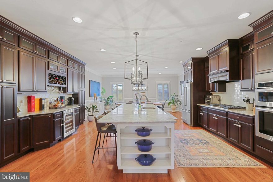 Absolutely gorgeous 20 ft. wide  luxury townhome in the heart of Canton!  This home features a 2 car garage, 3 massive bedrooms and 3.5 baths. Custom lighting and hardwood throughout and brand new 100% wool luxury runner through each floor staircase. Entry level bedroom/family room with full bath. Gourmet kitchen with 11 foot island, stainless steel appliances, 42 inch+ cabinets, gas cooktop and built-in bar. Spacious living room and dining area. Plantation shutters and recessed lighting. Up to date Smart home (hardwired outdoor and indoor google Security/camera system) with sound system. Primary bedroom with coffered ceiling, en suite bath with stand up shower and sunken tub, walk-in plus two additional custom closets. Additional bedroom and hall bath on upper level. Bonus 4th floor with wet bar and front and rear roof top decks. This space additional space can also be utilized as a loft guest room. Brand new roofing.  This property is in pristine condition and looks like a model home right in the heart of Canton (a couple blocks from Safeway, Rite Aid, coffee shops, restaurants and much more)!