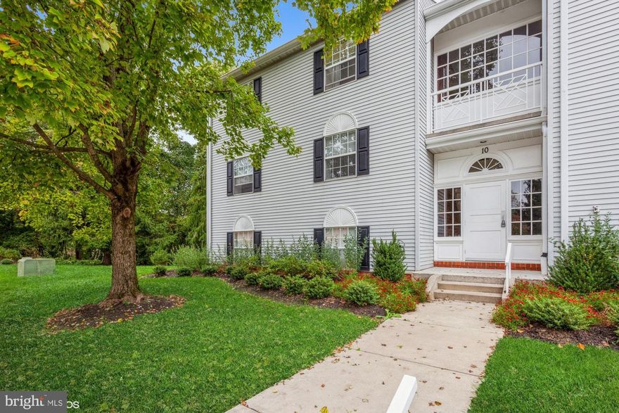 NO STEPS! Fantastic opportunity to own a highly desired garden floor condo in the Mays Chapel community.  The owner has replaced all flooring with brand new luxury vinyl flooring and freshly painted in neutral colors.  This light filled two bed, two full bath home offers large sized rooms with open floor plan, allowing for easy entertaining with tons of storage.  In addition, enjoy an oversized laundry room as a nice bonus.  Step outside your sliding doors and enjoy coffee while watching the birds on your ground level patio. A truly peaceful place to call home!   FHA approved.