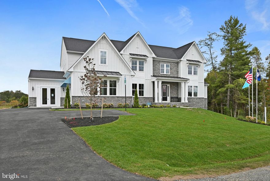 MODEL HOME -- THE ARLINGTON III -- Your dream home awaits.  This queen of our Legacy Portfolio has been adored by many for over a decade - now modernized with 10-ft main level, 20-ft great room; 9-ft. on others.  With the elegant two-story foyer with double entrance staircases, rear staircase and every design appointment you desire -- like custom light fixtures, custom trim work and more, it is sure to be your favorite, too.   The extended  kitchen is magnificent and includes upgrade cabinets, quartz countertops, contrasting over-sized island, walk-in pantry, upgraded stainless steel appliances, plus an adjacent dining area and morning room area and Butler's pantry, plus two built-in features to accommodate study or work areas.  The great room boasts a soaring two-story 20-foot ceiling and inviting fireplace with stone surround to the ceiling.  The extended home office includes an adjacent full bath with walk-in shower and closet.  Also on the main level is a spacious in-law/au-pair suite with large walk-in closet and large bath with walk-in shower, double vanity and private water closet and a large linen close.  Each bedroom on the upper level has its own en-suite bath.   The primary suite includes a sitting area, two large walk-in closets, an ultra spa bath with over-sized shower with dual shower heads and rain shower, plus a vessel tub, a wall-to-wall dual vanity with upgrade cabinets and quartz countertops.  AND, this home includes both an upper and main level laundry room.   To complete this model tour, check out the partially finished lower level with huge rec room that includes a convenient wet bar, plus an over-sized den/bedroom area and full bath.  This is our model home here at Tanager, so you are welcome to  view this incredible home.   Don't just imagine all it offers on a one-acre homesite! Visit us today to claim this luxury model home as your own.  Prices and terms subject to change.