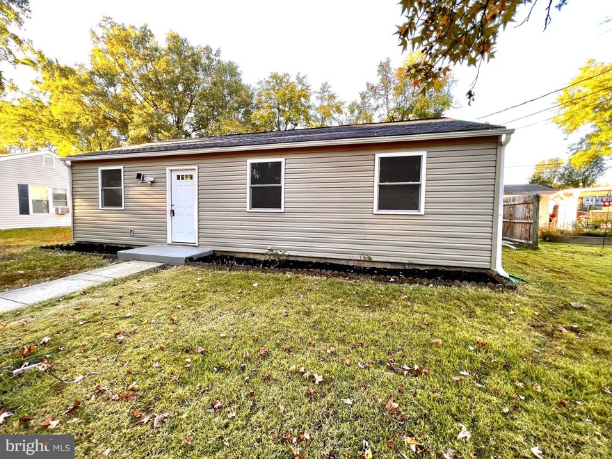 Exquisite and completely remodeled 3 bedrooms and 2 baths home is ready to move-in. This house is perfect for first-time buyers and for buyers looking for a home that offers one-level living!! The main level features a spacious living room and breakfast area with access to the backyard. The galley kitchen is very chic and sets the tone of the extensive renovation done to the home. Brand new kitchen (2022) features Quartz countertops, designer backsplash, shaker cabinets, SS appliances, and beautiful porcelain floor tiles. The primary bedroom is very well-lit and has a reach-in closet.  The primary bathroom has a shower tub with floor-to-ceiling wall tiled and a designer vanity with overhead light. The second and third bedrooms are roomy and bright.  The second bathroom features, contemporary vanity, cool overhead light, and a standing shower with mosaic tile, floor-to-ceiling wall tile, and porcelain floor tile. The backyard space is very serene, backing to woods, and perfect for entertainment and parties. New Roof (2022), New Contrlised HVAC with new duct work (2022), New Siding (2022), New Luxury Vinyl floors throughout (2022), New windows (2022), Freshly painted (2022), Recessed lighting (2022). Close to restaurants and transit. Conveniently located close to Gov. Ritchie Highway and less than half a mile from Harundale Plaza, LIDL grocery store, and Library.