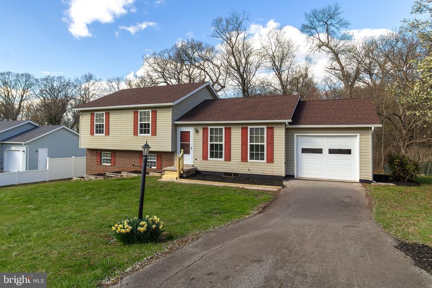 Welcome to this beautifully maintained and newly updated 4-level home, offering over 2,300 square feet of living space, nestled on a scenic 0.29-acre lot that backs to mature woods for added privacy and serenity. This spacious home features 3 generously sized bedrooms and 2 full bathrooms, both recently renovated with modern finishes. Step inside to discover fresh paint throughout, brand-new carpet, and stylish luxury vinyl tile flooring on the main level and lower-level family room. The updated kitchen boasts contemporary cabinetry, new countertops, and a bright, open layout perfect family comfort. Additional updates include a new roof, gutters, and downspouts (2023), along with new sliding glass doors with built-in blinds and an insulated garage door. (2024) The gas furnace (forced hot air) has also been updated, ensuring energy-efficient comfort year-round. Located in a sought-after neighborhood known for its excellent schools, this home is just minutes from local shopping, restaurants, and churches—offering the perfect blend of comfort, style, and convenience. Don’t miss your opportunity to own this move-in ready gem in Hanover!