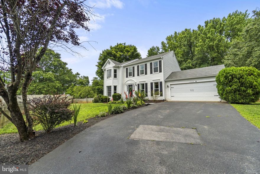 Price Improvement -- Welcome home to 14020 Heatherstone Drive in the Old Stage Knolls community of Bowie. This 5+ bedroom, 3.5-full bathroom Colonial includes a totally custom upgraded kitchen with a gorgeous tile backsplash and all new stainless appliances. 
Situated back from the street, enjoy your yard of almost 1/3 acre in a quiet community . Enter the front door to gleaming luxury plank flooring throughout the main level. Walk out to the backyard paver patio from the living room and enjoy your fireplace during the winter. 
Sellers have made several major enhancements: all new windows (2020), new garage door, (2023) renovated bathrooms and kitchen (2021), and more. Upstairs, you will find 4-spacious bedrooms, and 2-full bathrooms. Enjoy tons of natural light in the primary bedroom, complete with built-in closets for optimal storage.
Basement has rec space, two bedrooms/dens, a full bathroom and storage space. Community amenities include a park, playground, basketball courts and more. Ideal location – perfectly situated within close proximity to Baltimore, DC, Annapolis and Fort Meade. Don’t miss the opportunity to get into this desirable neighborhood – book your appointment today!