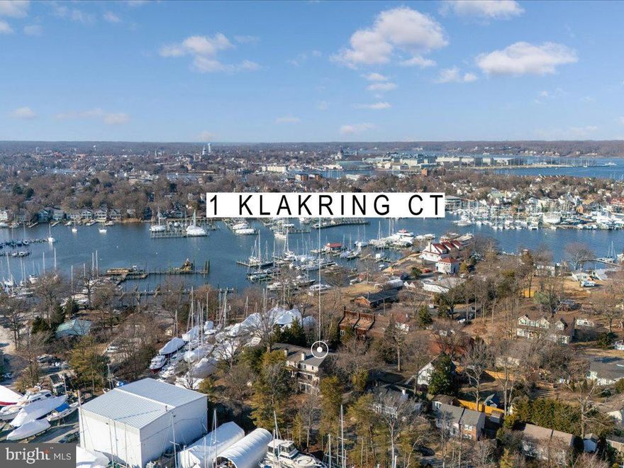 Coastal charm meets everyday comfort in this townhome nestled on a peaceful peninsula between Port Annapolis and Annapolis Landing marinas. This rare end unit offers a blend of spacious living and modern updates, all at an exceptional price point. With winter water views and peek-a-boo summer views of Back Creek, this three-level home delivers the perfect comfort of a full-time residence with the serenity of a vacation escape in the heart of the sailing capital of the world. Step inside to gleaming hardwood floors and an open-concept layout designed for both relaxation and entertaining. The generous kitchen passthrough flows seamlessly into the dining and living spaces, where a wood-burning fireplace sets the scene for cozy evenings. Enjoy outdoor living with a patio on the ground floor and balconies on each of the upper levels, filling the home with abundant natural light. The flexible entry-level bedroom/office/den features a private entrance to the terrace, making it ideal for guests, a home office, or a quiet retreat. Upstairs, the primary suite features an en suite bath with a step-in shower. Updates include a brand new water heater for added peace of mind. With no HOA fees and an oversized garage, this home is an extraordinary find in an unbeatable location. You’re enviably close to Capital SUP, Annapolis Sailing School, Annapolis Boat Club, the Maritime Museum Park, Black Market Bakers, and Ellen O. Moyer Nature Park. Need a lift to downtown Annapolis? Just hail the water taxi from C Dock, just down the path from your door. For an even more luxe lifestyle, opt for a social membership at Port Annapolis Marina, granting access to a pool, fitness center, pavilion, picnic areas, and playground.