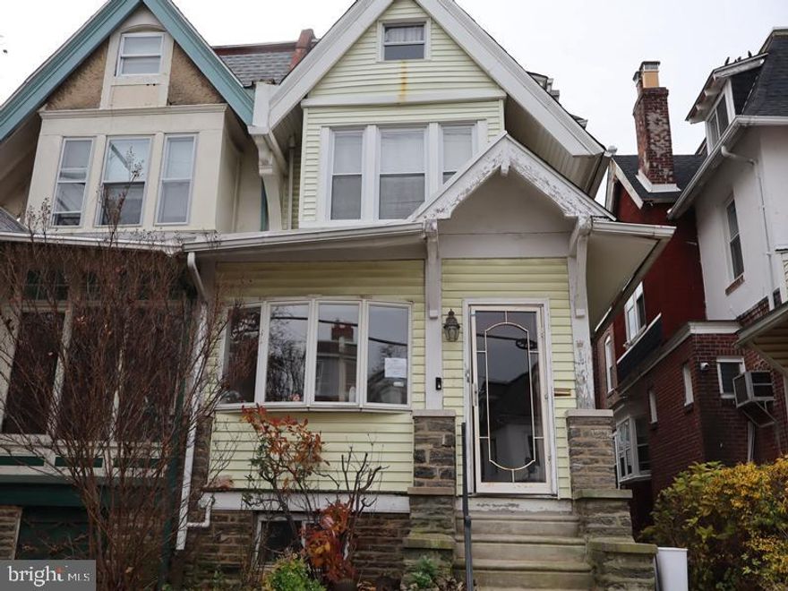 Grand opportunity awaits with this 2.5-story twin home, built in 1965, located in the desirable West Oak Lane section of the city.

The main level features a spacious enclosed porch, a living room with a fireplace, a formal dining room, a breakfast room, and a kitchen with walk-out access to the rear yard—perfect for entertaining or relaxing outdoors.

The second floor offers three generously sized bedrooms and a full hall bath. The third floor provides two additional bedrooms and a three-piece bath, offering flexible space for guests, a home office, or extended living. The unfinished basement adds excellent storage potential.

Additional highlights include ample on-street parking and a prime location close to shopping, schools, and parks, with convenient access to major roadways throughout Philadelphia.