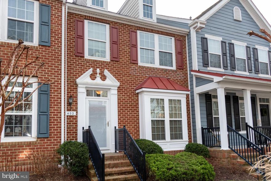 With a great location just blocks from Easton's charming historic district, this beautifully-maintained three bedroom townhome has style. the main level features are large living room with hardwood floors leading to an open kitchen/dining room separated by an island. Off the kitchen is a spacious deck with retractable awning. The upstairs bedrooms include a large primary suite with vaulted ceiling. The walk-in closet has a window and high quality built-ins. The primary bath has double sinks, walk-in shower and soaking tub. Down the hall are the full bath and two bedrooms, ingeniously connected with a barn door. 
Another living room space on the lower level could be an office or playroom and leads to the laundry, then out to the two-car garage. The Rails to Trails path is nearby.
