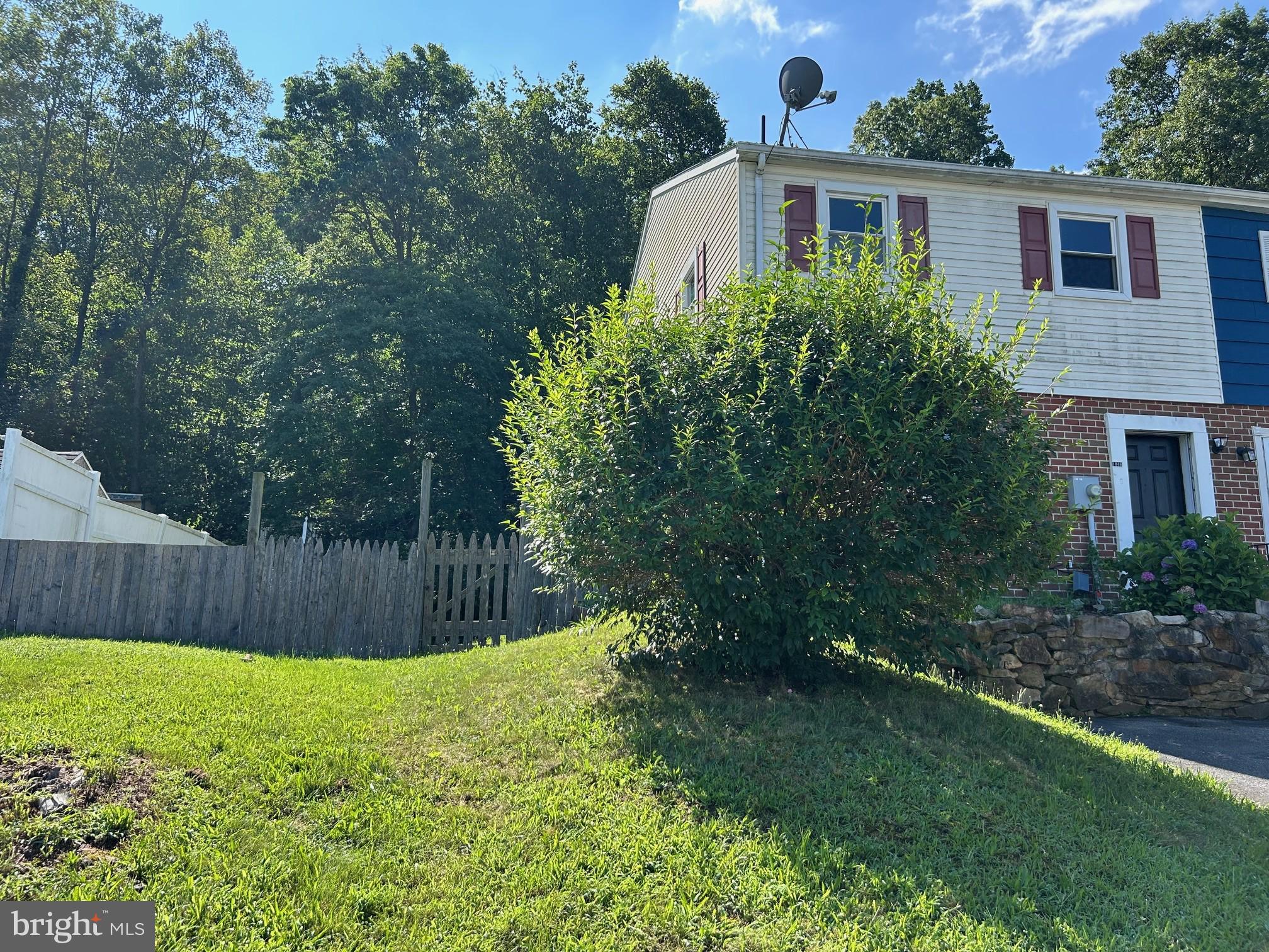 Updated kitchen and bath in this 3 bedroom, 1.5 bath end unit townhouse. New carpet, new floors. Living room with fireplace and slider to the patio and large fenced rear yard.