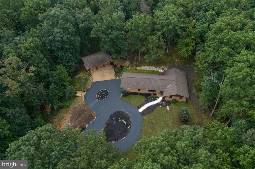 Escape to your own private retreat only minutes from rt.66. 5+ glorious wooded acres, off the beaten path but close to peaceful Haymarket and Warrenton.  Custom built 3 bed 2.5 bath home with a big 3 car detached garage perfect for projects and room for boat or RV storage with no HOA, handmade custom kitchen cabinets, wood burning fireplace, perfect to entertain or just relax in true peace & quite