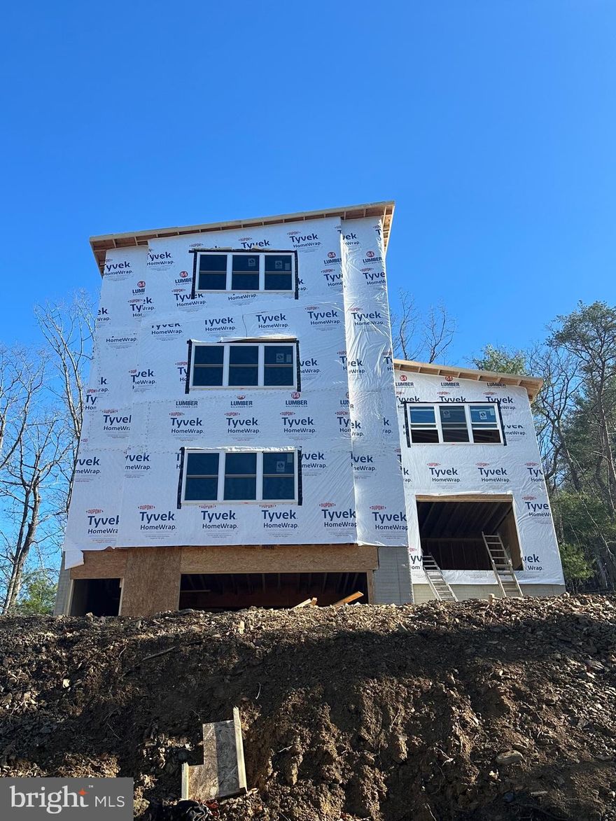 New photos “Epic Views" Nov 26 2025 Update: Additional bedroom and bathroom to complete the top floor primary suite has been added.  That's a total of 4 bedrooms and 5 bathrooms! Also, an amazing game room to be outfitted on the lower level!  Completion around March 2026.  Quality unparalleled luxury in this stunning new construction home, perfectly situated just half a mile from the prestigious Bryce Resort Center. This architectural masterpiece promises to be a haven of modern elegance nestled in a rustic setting.  This expansive residence boasts four levels, featuring three spacious bedrooms, each with its own ensuite full bathroom, and an additional half bath on the main level. The open-concept kitchen is a culinary dream, complete with a grand island offering ample seating, perfect for entertaining. The adjoining dining area is designed to accommodate large gatherings with ease. The great room is designed for comfort and style, with space for a large sectional and seamless access to an outdoor deck, ideal for enjoying the serene mountain vistas. Additionally, the home includes a garage on the basement level, a rare feature in this area, providing both convenience and added value. High ceilings throughout the home enhance the sense of space and luxury. This home is a testament to high-quality craftsmanship and exquisite finishes, tailored for discerning buyers with impeccable taste.  Walk to Bryce Resort!