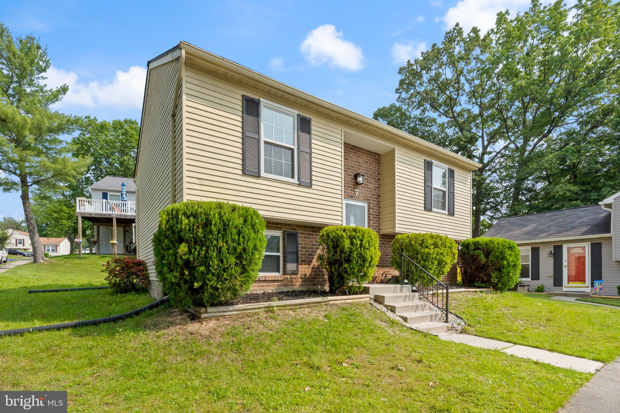 Beautifully renovated 3BR/2BA split foyer Ranch located on a corner lot in the quiet neighborhood of Perry Hall. Ample parking is just steps from the front door into your forever home. Step inside to a home filled with natural light, a neutral color palette, glamorous lighting fixtures, and stunning flooring. The main floor offers a large living room, a spacious dining room, a new kitchen, three bedrooms, and a brand new full bath. The kitchen features plenty of cabinets to the ceiling, stainless steel appliances, quartz countertops with a complimenting tiled backsplash, and a stainless sink. The lower level offers additional living space featuring above grade windows, a full bath with a walk-in shower and a double sink vanity, a possible 4th bedroom or home office, space for the family to enjoy, laundry, storage, and a walk-out to the yard. From the sliding doors on the main floor, step outside onto a large deck that overlooks the yard offering so many possibilities. This home is move-in ready with so much to offer new homeowners, and is located in close proximity to shopping, restaurants, and commuter routes.