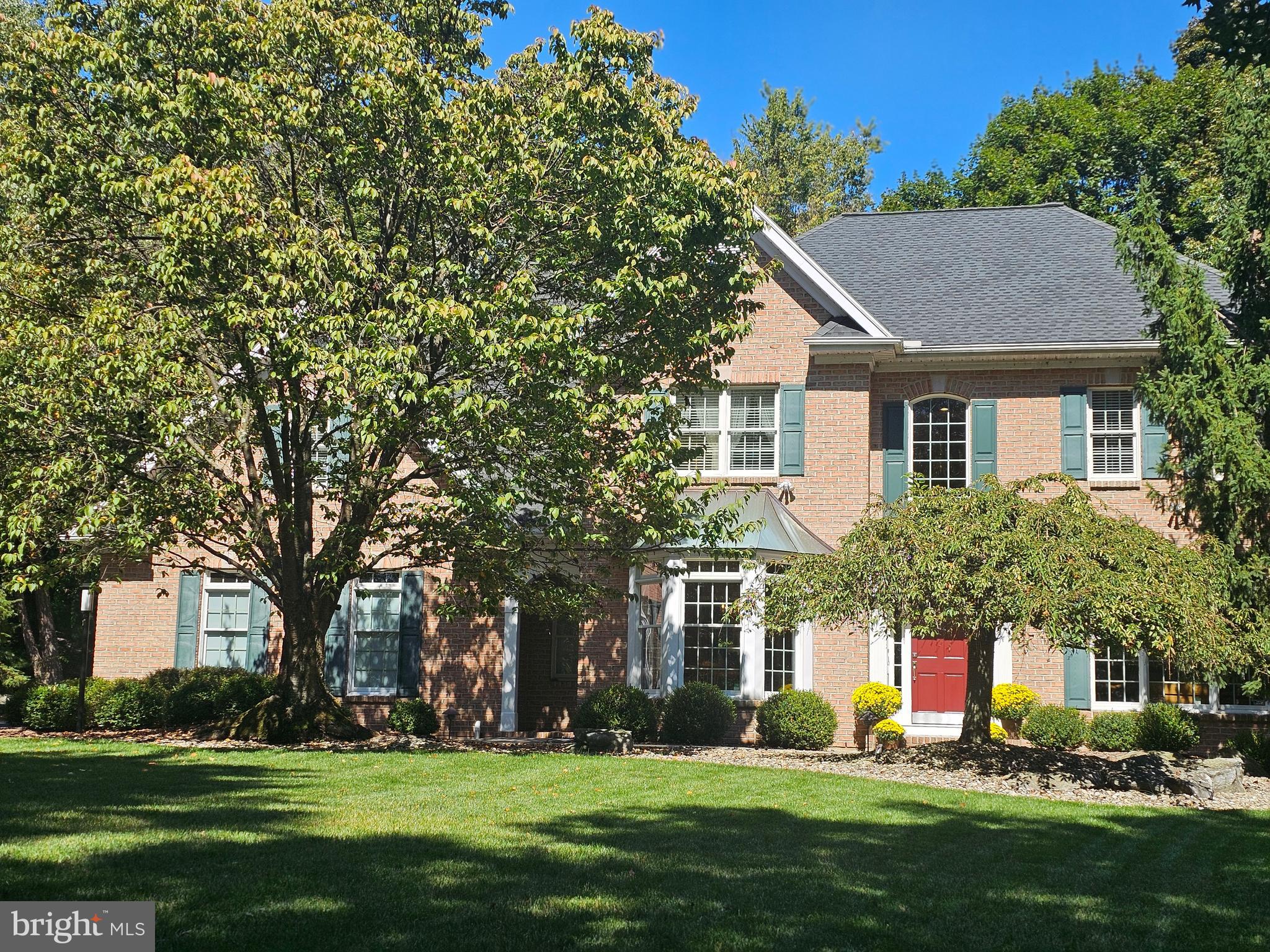 Welcome to this exquisite 2-story colonial in sought-after Williams Twp., where luxury meets craftsmanship. This stunning 4-BR, 2.5-bath residence offers an impeccable blend of sophistication & comfort. The grand entrance leads you to a front living room featuring a custom decorative fireplace, perfect for cozy evenings. The formal dining room boasts a triple bay window, creating an inviting space for elegant dinners. The heart of the home is the chef’s kitchen, outfitted w/top-of-the-line custom cabinetry, a granite island, & a Wolf gas stovetop, making it a culinary haven. Adjacent is the soaring 2-story family room, showcasing a striking Western cedar accent wall & majestic stone fireplace, ideal for gathering and relaxation. Upstairs, the luxurious master suite is a true retreat, complete w/a new bath, a private sitting room/den, & a balcony overlooking the serene wooded lot. Every detail has been carefully considered, from the hardwood floors throughout most of the first floor to the recent updates including a newer roof, gutters and leaf guard system, driveway, and well tank/pump. Outside, enjoy the meticulously crafted custom landscaping and lighting, and unwind on the Western cedar deck. Additional highlights include a 1st-floor laundry with a chute and sink and an abundance of quality finishes. The security system and 1-year home warranty provide peace of mind. This home is a rare find, blending classic colonial charm with modern amenities in a picturesque and private setting.