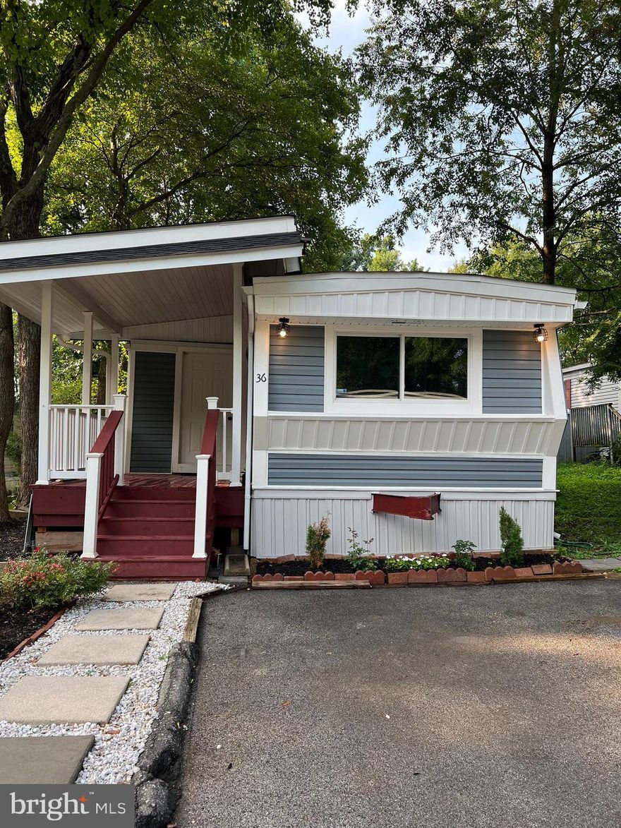 Current price improvement. Don't be shy to submit an offer, home owner is open to ALL negotiations and said to bring us an offer and let's make a deal work out! Howard county affordable living. Very nicely updated 3 bedroom, 1 and a half bathroom home is ready for you to move in! Freshly painted, newer waterproof vinyl flooring. Kitchen recently remodeled with beautiful backsplash, granite counter tops, white cabinets, built-in trash binds. 2022 remodeled full bathroom with stunning ceramic title and beautiful granite shelving/countertop. Two car driveway with plenty off street parking, 2021 built covered porch and secure 2021 built storage shed. 2021 Vinyl siding. Great location close to excellent schools, parks, shopping and restaurants. Minutes to Rt's 100, 95, 295 and 40. Note: $950.00/month ground rent to the mobile park includes water, property taxes, trash/recycle pick up and snow removal - Home sale is contingent upon buyer obtaining park approval. 
Déjeme saber si necesita más informacion en Español enviando un mensaje de texto al numero que comienza en 240 cual se encuentra a la par de mi nombre. - Andrea