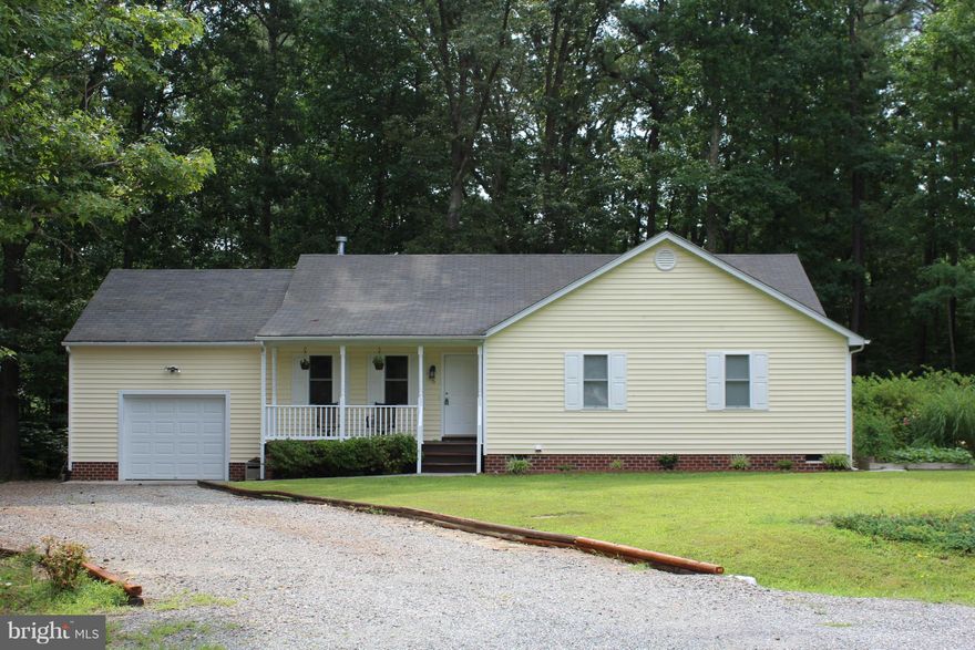 No carpeted floors. No vinyl floors. Only hardwood and ceramic tile floors. Covered front porch looks out on play area in front yard & the cul-de-sac. Kitchen w/ pantry & closet. Separate dining room. Separate family room w/ gas fireplace. Master bedroom. Master bathroom w/ soaking tub & separate shower. Level, grassy lot. Garden area. Deck.  Backs to woods & privacy. Private lake neighborhood.