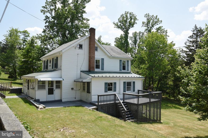 Adorable farm house on 2 acres in Smithsburg!  Great opportunity to have plenty of space!  Large living spaces on the main level with covered porch at the front and bonus room/ office on the main level.  Eat in kitchen with an additional dining area off the living room.  Upstairs has 2 huge rooms. One can be turned into 2 rooms if needed. Spacious deck is great for relaxing and taking in nature. Parking pad available on the opposite side of the house from the garage.   Lot includes open fields for planting and raising animals as well as wooded area.