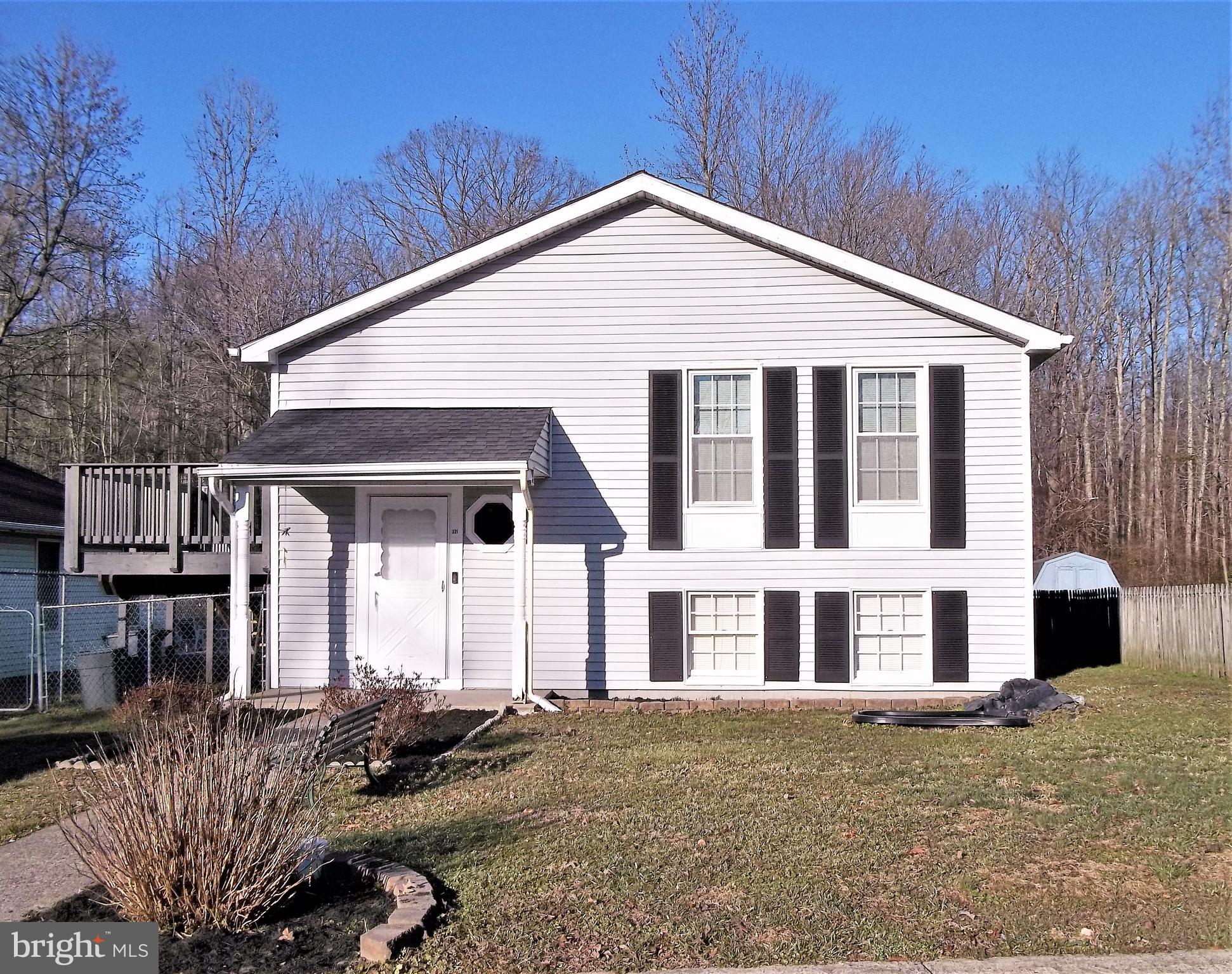 Single family home for a townhouse price! Easy to show and can settle quick. 3 Bedrooms & Full bath, Kitchen & LR on the upper level. Lower level has Bonus Room(Office or Hobby Room), 2nd Full Bath, Large Family Room. LL storage room (15X12) would make a great work room and has Bilco doors that exit to Back Yard. Large Laundry Room (15X11) provides lots of storage. Recent Roof, Most Windows Replaced, Heat Pump new in 2019 and Deck new in 2019. Back Yard is fenced and Shed is included. Property backs to woods. Convenient Location-Close to APG and Major Roads. No HOA!