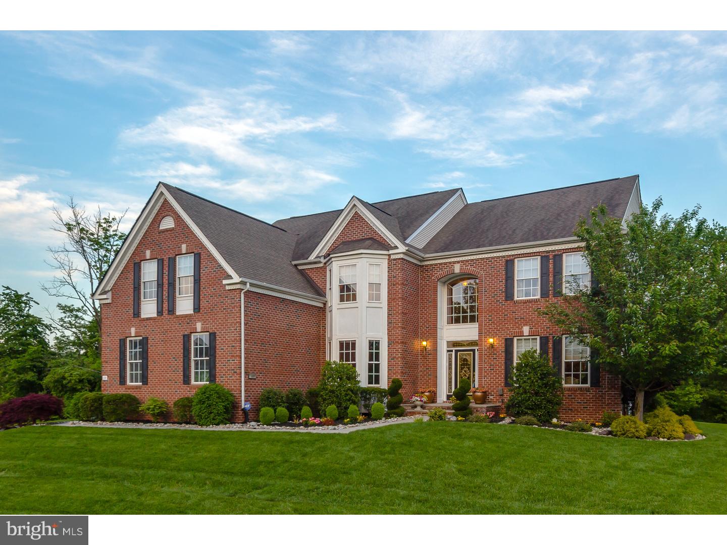 MOTIVATED SELLER!!Welcome to one of the finest homes The Woods At Northampton can offer.  Tucked away in a serene and private corner of Northampton Township is an elegant residence the most discriminating homeowner would be proud to own.   The stately brick front exterior and the carefully landscaped and manicured grounds are your first hint of the perfection that's yet to come.  The main door with sidelights and transom leads into a soaring two-story foyer with an arch window over the doorway and a dramatic stairway.  To the right are the formal living and dining rooms where high ceilings, wainscoting, crown moldings, and architectural columns enhance each area, along with hardwood flooring and recessed lighting.  French doors on the opposite side of the foyer lead into a private and spacious study with a walk-in bay window.   Continue on to a gracious family room, another two-story area with a wall of circle-topped windows, a gas fireplace with a detailed mantel and surround, and a stairway leading to a loft area that overlooks the family room.   The kitchen is as beautiful as it is functional, with furniture-quality cabinetry with 42" upper units, stainless appliances, granite counters, pendant and recessed lighting, and ceramic flooring.  The kitchen flows into an addition with a cathedral ceiling that's created an open, airy, light-filled dining area with plenty of room for comfortable seating and a breakfast bar.  An exit door leads to the large paver patio and the lawn beyond.  The entire rear of the house incorporates the sunny outdoors with its beautiful views of the greenery and the creek that border the property's rear.   Upstairs, the master suite again features a vaulted ceiling and offers a large sitting room adjacent to the roomy bedroom, and a beautiful master bath with a garden tub and ceramic surround, an oversized shower, and double sinks in an expansive vanity.   Three additional bedrooms are each generously sized and own great closet space.  A two additional full baths complete the second floor.    A full, finished basement adds tremendous living/playing space and another full bath, and still includes a large unfinished work/storage space.   There's a three-car garage, 2-zone gas heat, gas cooking, and too many special details to list.   A visit here will give a full appreciation of all this house offers and a need to make it yours!