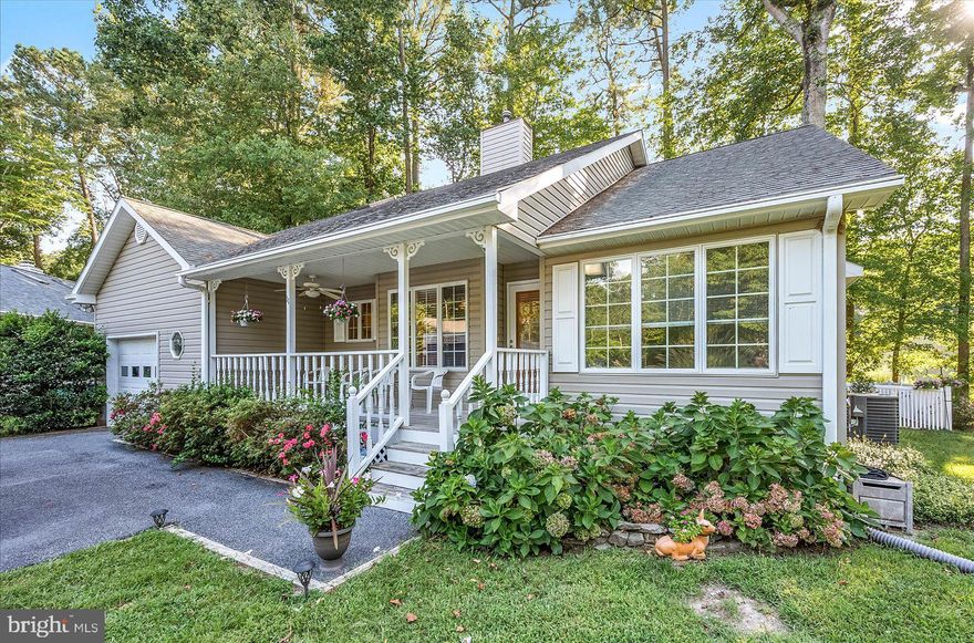 Here is a lovely 4 bedroom, 3 bathroom home in amenity rich Ocean Pines. It is nestled on a quiet cul-de-sac in the North Gate. There is nice curb appeal with landscaping and a charming covered front porch with decorative wood detailing. Greeting you as you walk onto the porch is a beautiful etched heron on the glass storm door. When you enter, the sky high ceilings and lots of natural light are what stand out in this home. More desirable features include a 4 season sunroom with French doors, a nice loft with 2 skylights, a double sided gas fireplace, a large deck and a fenced-in backyard. The primary suite has 3 closets, a window seat with storage & an ensuite bathroom that has a vanity with plenty of counter space. This is a split bedroom floor plan so 2 bedrooms & the 2nd bathroom are off the other side of the living room. The 4th bedroom & 3rd full bathroom are on the 2nd floor. The utility room has cabinet & shelf space and leads to the 1 car garage that has extra storage space. There are 2 split ductless systems for cooling on the 2nd floor. The Ocean Pines area has just about every type of business you could want. The community offers a lot of options including parks & ponds, basketball courts, baseball fields, pickle ball, tennis, golfing, swimming pools, marina, yacht club, a beach club in Ocean City & more! There’s also a farmers’ market, a library & a police department.  You can conveniently access this property from either the North Gate or Beauchamp Rd. Make an appointment to take a look. Remember Life is Not a Dress Rehearsal, Own at The Beach!