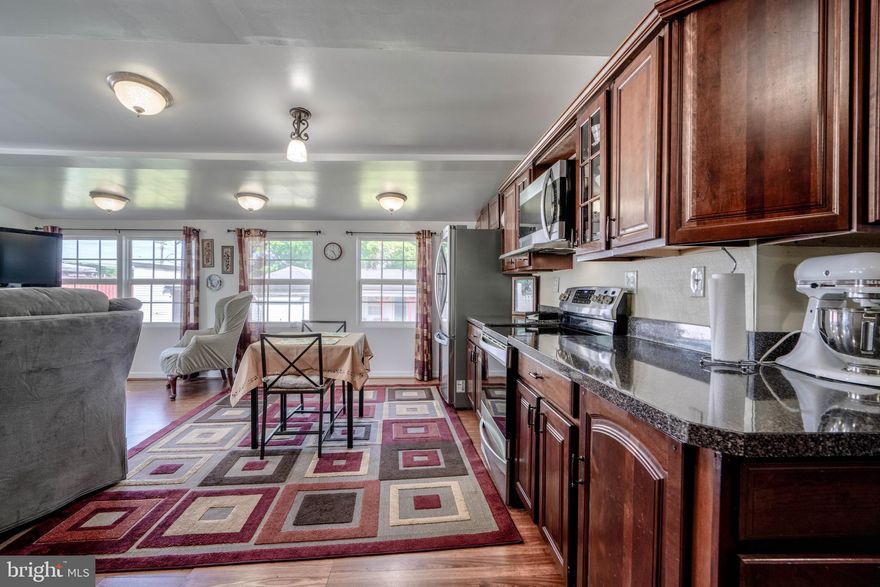 *** MOVE RIGHT IN -- to this  4BD/2.5 BA  w/  UPPER LEVEL IN-LAW SUITE, SEPARATE CABANA HOUSE (19x11), STORAGE AREA ((22x14), & CONCRETE-FLOORED WORKSHOP (22x12 w/7.8-FT ROLL-DOOR, AND 134-FT DRIVEWAY w/ SPACE FOR 7 VEHICLES! ***  FRONT of home has a 7x6 covered porch with 2  doors, one leading to the IN-LAW SUITE upstairs, and the other to the main level. 
 Once inside either door, both can connect inside via another door if preferred.   *** The MAIN LEVEL  includes:  a SPACIOUS BRIGHT LIV RM w/VAULTED CEILING * 2 MAIN LEVEL BDRMs, one  w/BUILT-IN DOUBLE ORGANIZING CLOSETS & SPACE for  TV * FULL BATH w/JETTED TUB,  decorative tiled shower, & built-in Linen Closet  *   DINING RM leading into KITCHEN w/ S/S APPLIANCES including: DOOR-IN-DOOR FRIG & D/W (still under ext. warranty!), INDUCTION STOVETOP (surface does not get extremely hot-- requires iron or steel based pans,  great for keeping little hands safe!) , GENEROUS AMOUNT OF CABINETRY & COUNTERSPACE, DOUBLE SINK, & BUILT-IN STORAGE AREA w/COUNTERTOP & ROLL-OUT SHELVES along with LARGE DRAWER STORAGE!  PLENTY of room to cook and for family to gather! * KITCHEN leads into FAMILY RM w/VAULTED CEILING & WALL OF WINDOWS, with sliding glass door opening to 20x12 DECK AREA for CONVENIENT ENTERTAINING & steps leading down into back yard! *** UPPER LEVEL is cooled by WINDOW A/C UNIT, and connected to rest of home with doored stairway, and can serve as a separate IN-LAW SUITE, TEEN ROOM, or GUEST SUITE, and includes a LARGE BDRM w/WALK-IN CLOSET,  Kitchen w/walk-in pantry,  and FULL BATH w/STALL SHOWER,   *** LOWER LEVEL offers: * 4TH BDRM w/WALL OF CLOSETS * HALF BATH (toilet only) *  BONUS/HOBBY ROOM w/BUILT-INS * LAUNDRY/UTILITY RM w/PANTRY AREA.  ***  NESTLED JUST OFF NORTH POINT RD,  convenient to shopping, restaurants, & nearby points of interest (Sparrows Pt. Golf & Country Club ... North Point State Battlefield Park ... 10 min to North Pt. State Park (with hiking trails, biking trails, picnic area, swimming area, & fishing pier), ... only 6 min drive to Stansbury Park w/walking trail, pond & fishing pier & playground, Merritt Park & Chesterwood Park, to name a few), & w/easy access to 695 & only a few minutes to 95, THIS UNIQUE HOME OFFERS A GREAT OPPORTUNITY! ***  DON'T MISS THIS !!! ***