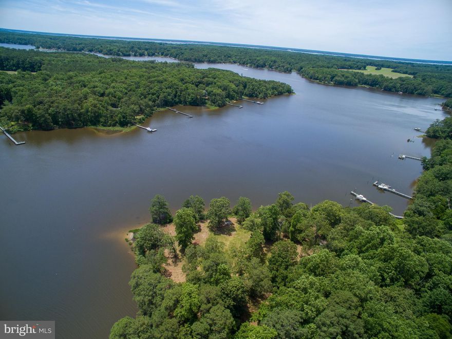 Wrap-around water views and deep water make this point of land an idyllic setting to build your dream home! With underground power already installed to the building site and the point mostly cleared, you can begin construction on your river home quickly! With over 700' of shoreline and 3.5 acres of land, this property provides excellent privacy. The building site is elevated out of the flood zone with a gentle slope to the waters edge. Located on the Corrotoman River, it is an easy trip to the Rappahannock River and Chesapeake Bay. Beaches, restaurants and small towns are also accessible by boat. It is possible to install a dock with 6'+ of water for your sailboat or motor yacht (purchaser to verify). By land the property is located close to the towns of Kilmarnock and Irvington. Dining, shopping, movie theater, golf courses and hospital are all close by. There is a 4 bedroom septic letter on file with county which gives you the ability to build a large home or develop an estate style property. Other unique features include a grandfathered deck within the 100' RPA, installed artesian well and large shed (conveys as-is). Don't miss your opportunity to own this amazing property