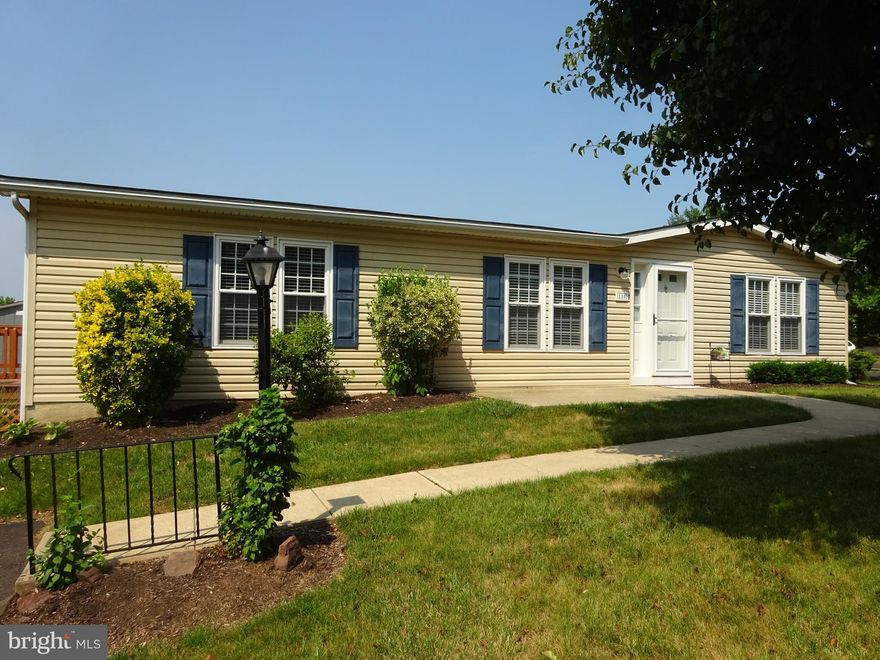 Enjoy this popular 55+ community of Hidden Springs.   This home has been completely renovated.  The Kitchen has new cabinets, countertops, and Frigidaire stainless steel appliances, smooth top 5 burner self-cleaning range, dishwasher, and refrigerator plus an Insinkerator garbage disposal.Both Bathrooms have been replaced as well complete with large vanities. There is a large new stall shower in the Primary Bedroom Bath and new full tub and shower unit in the Hall Bath. The Primary Bedroom has a huge walk-in closet measuring 8’ x 7’ while the second Bedroom offers two double door 5’ closets. Obviously the entire interior has been professionally painted in current colors and there are beautiful new laminate floor coverings throughout except for in the Bedrooms where there is new carpeting. There is a new vapor barrier in the crawl space.  The 11’ x 10 side deck is brand new with steps to the yard.   Hidden Springs is very desirable, well managed and full of amenities, pool, club house, and much more.