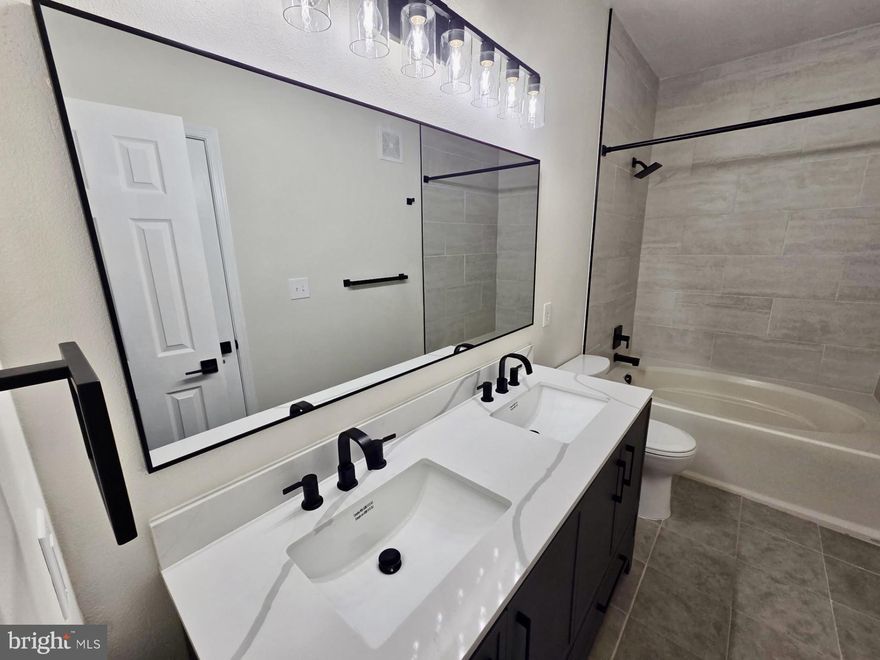 Fully Renovated Condo with Wrap-Around Deck & Two Deeded Parking Spaces in Ashmore at GermantownWelcome to this beautifully fully renovated, move-in ready condo located in the desirable Ashmore at Germantown community. This stylish home has been thoughtfully upgraded throughout and offers the perfect combination of modern finishes, comfort, and convenience.The kitchen features quartz countertops, refaced cabinetry, and a full suite of brand-new stainless steel appliances, creating a sleek and functional cooking space. Updated lighting fixtures and ceiling fans add a modern touch throughout the home.The bathroom has been completely gutted and professionally remodeled, showcasing new ceramic tile flooring and tub surround, a luxurious jacuzzi soaking tub, double quartz vanity, and contemporary matte black fixtures that create a spa-like retreat.One of the standout features of this home is the large wrap-around private deck, offering rare outdoor living space perfect for relaxing, entertaining guests, or enjoying morning coffee.The property also includes two assigned  parking spaces, a valuable convenience that is not commonly available with many condo units.Highlights• Fully renovated interior• Brand-new stainless steel appliances• Quartz countertops• Completely remodeled bathroom with jacuzzi tub• Double vanity with modern fixtures• New ceramic tile flooring• New lighting fixtures and ceiling fans• Refaced kitchen cabinetry• Large wrap-around private deck• Two  parking spaces• Move-in ready conditionConveniently located near shopping, restaurants, parks, and major commuter routes including I-270, this home offers easy access to Rockville, Bethesda, and Washington DC.This beautifully updated condo is turn-key and ready for its next owner.