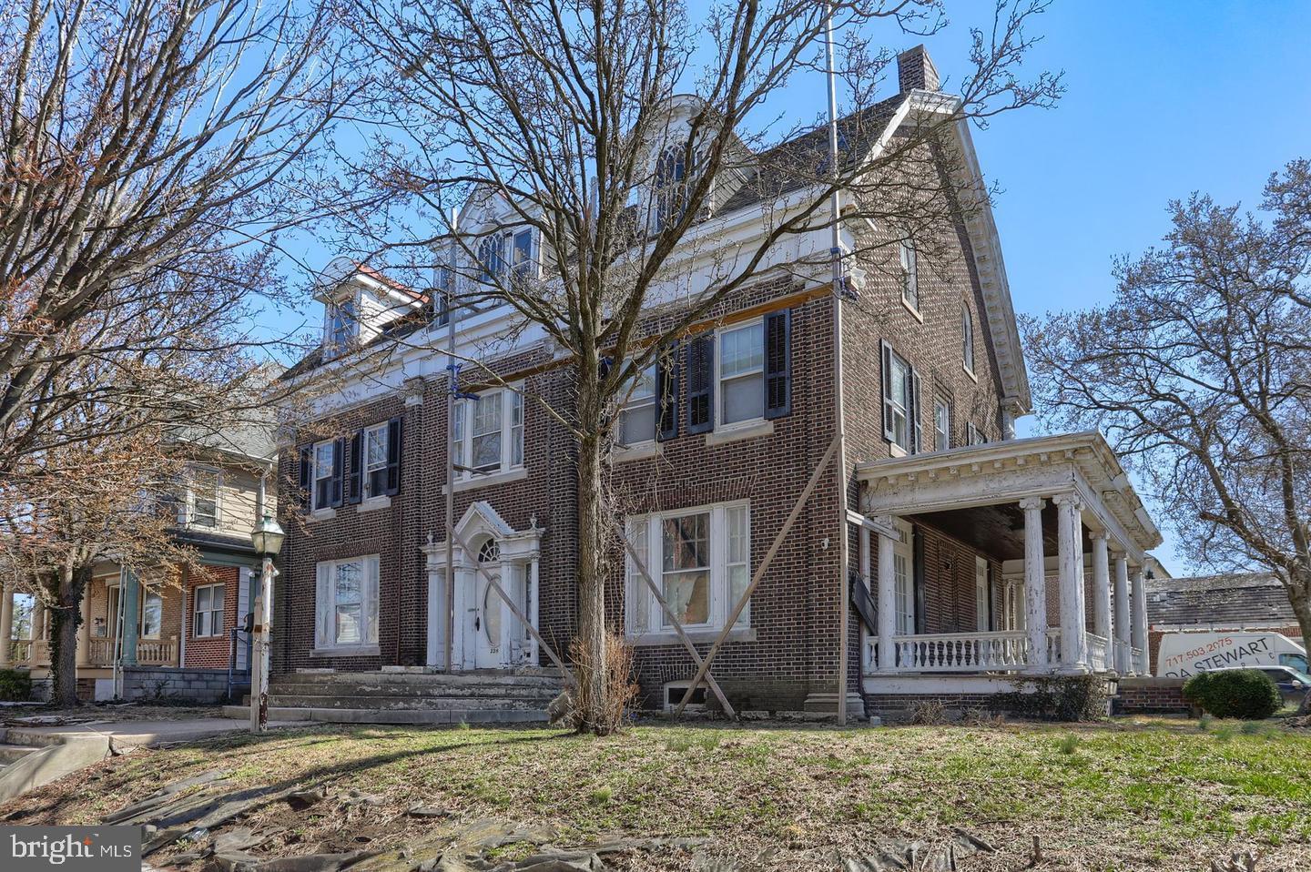 Step into a piece of history with this grand 3-story Colonial home boasting over 5,000 square feet of living space! This expansive property features 9 spacious bedrooms and 4.5 bathrooms, making it perfect for a large family or multi-generational living. The home's charming character shines through with its high ceilings, hardwood floors, and two fireplaces that create a warm and inviting ambiance. The impressive layout offers ample room for entertaining, while the generous bedroom count ensures comfort and privacy for everyone. Additional features include a 1-car detached garage and natural gas heating for efficiency and convenience. Situated close to numerous amenities, this property offers both a prime location and immense potential. With some thoughtful updates and restoration, this architectural gem could be transformed into a true showpiece. Don't miss your chance to own this remarkable Colonial estate — the possibilities are endless!