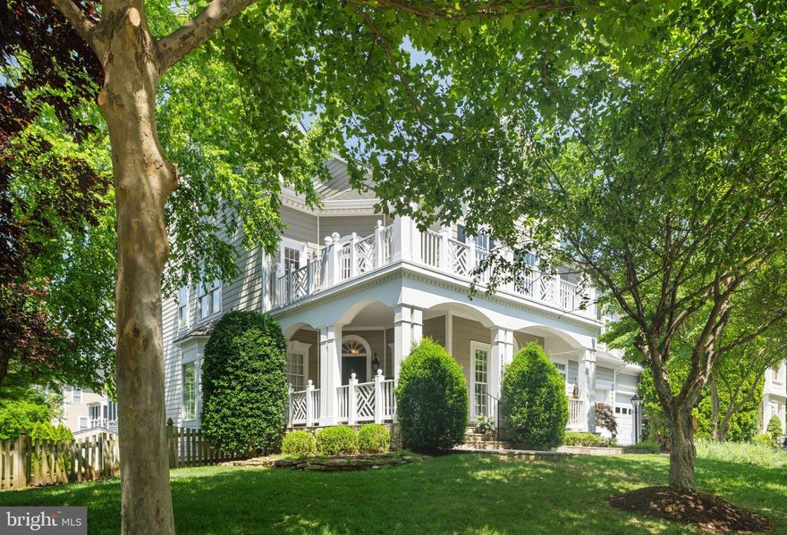 A distinctive masterpiece in every way, this Hemingway Model exudes sophistication, warmth, and thoughtful design at every turn. From the moment you arrive, it’s clear this home is truly one of a kind, curated by sellers who spared no expense. Inside, the expansive primary suite feels like a private retreat, complete with a sitting room, dressing area, custom walk-in closets, see-through fireplace, and a wine bar with built-in cabinetry. Enjoy morning coffee or a glass of wine at sunset from one of two private balconies, where quiet moments and sweeping views await. Each secondary bedroom features its own ensuite bath, all beautifully appointed with timeless finishes, upgraded window treatments, premium carpet, and custom closets. The bathrooms blend classic elegance with a refined, lasting style. The main level invites you to entertain or unwind in an atmosphere of effortless luxury. A French-inspired gourmet kitchen anchors the space, showcasing granite countertops, custom cabinetry, stainless steel appliances, an island and oversized breakfast bar, double ovens, and a charming bump-out breakfast nook. Hardwood floors flow into a dramatic family room with a stunning stone fireplace, a wall of windows, and access to an outdoor deck and screened-in porch. This level offers exceptional flexibility with multiple living spaces, including a sixth bedroom or private guest suite, a formal living and dining room with bay window, a cozy den, or create two separate home offices. Ideal for today’s lifestyle. The finished walk-up lower level is a showstopper, designed for entertaining and everyday living. A custom bar with granite countertops and full cabinetry creates the perfect gathering space, along with dedicated rooms for movies, workouts, games, or hobbies. There's even a full bath, bonus room, wine closet, built-ins, and additional storage to meet every need. Outdoors, the professionally landscaped yard is private and serene, framed by mature trees and highlighted by a flagstone patio perfect for summer evenings and s’mores. The fenced yard, irrigation system, and storage shed offer extra function without sacrificing style. Every room in this home feels like a feature in your favorite design magazine. Sophisticated yet comfortable, polished yet personal, this is luxury living that truly feels like home.