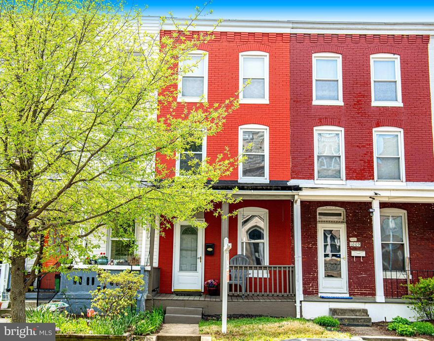 Charming front porch row home spanning three levels, located in the heart of Hampden. Just one block north of "The Avenue," enjoy excellent walkability to restaurants, shopping, public transportation, and more. Step into the main level living room, featuring NEW luxury vinyl plank flooring throughout. A faux fireplace adds character and warmth. The dining room flows into a spacious eat-in kitchen through custom cabinetry. The recently updated kitchen features white cabinetry topped with quartz counters and offers direct access to the rear deck. The first upper level features a full bath at the top of the stairs and two generously sized bedrooms. The second upper level includes two additional spacious bedrooms. The basement offers laundry facilities and plenty of storage space. Conveniently located near downtown and Johns Hopkins. Schedule your private showing today!