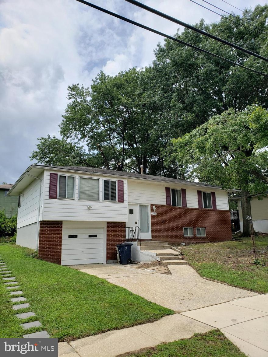 ***Handyman Special - NO FHA Financing.*** Don't miss this rare opportunity to own a 4 BR 2 full BA single family home with off street parking and attached 1 car garage.  Near MGM, Tanger Outlets and all the excitement at the National Harbor.   This home has "good bones" and is being sold as-is.  The Owner will make NO repairs.  UPSTAIRS:  The kitchen and bathroom areas have been gutted in preparation for renovation.  Plumbing work is complete and it's ready for your work crew to finish it off just the way you like it. (the used refrigerator in the picture DOES NOT CONVEY)  DOWNSTAIRS: The basement area has been fully renovated and was recently used as an Air BNB. (All furnishings and decorations appearing in the pictures have been removed.) - You'll want to sharpen your pencils for this one because it won't last long.  - This is truly a diamond in the rough. Submit your highest & best offer today!