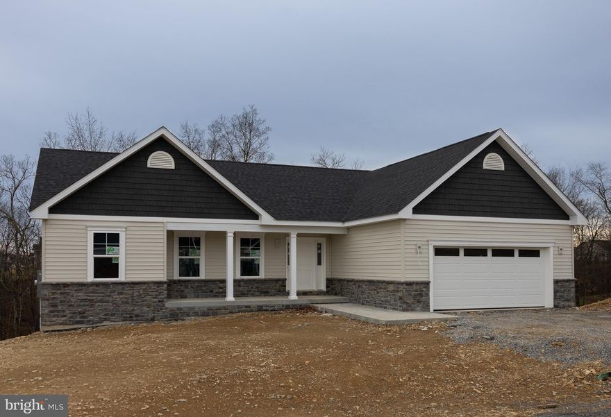 CONSTRUCTION IS COMPLETE.  READY TO MOVE IN NOW!!  It backs to trees so no neighbors behind you.  Home is being professionally cleaned. This home has a full, unfinished basement (a walk out basement, with a full bathroom rough in) and a deck already built onto the back.   The main level has a laundry room right outside of the primary bedroom and an open kitchen/dining/living room and a great front porch with plenty of room for rocking chairs.   The primary bedroom has a large walk-in closet with wooden shelving, a bathroom with a linen closet and a ceramic tile step-in shower & custom cut shower door.