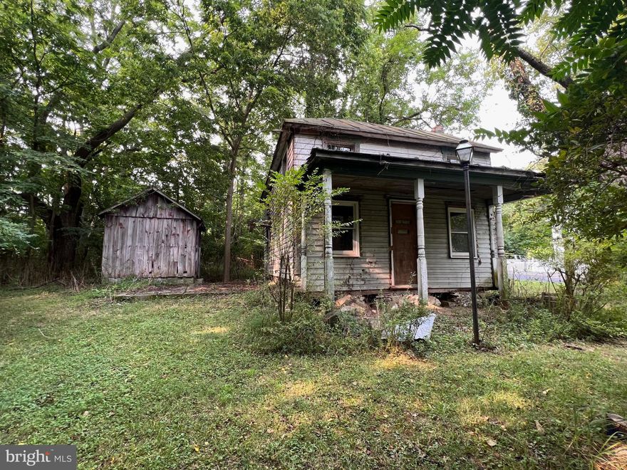 There is a small house on the property that has no plumbing. Buyer must do due diligence. Holes were dug, but no Perc test performed. It has electricity, but will need well and septic if water and sewer is needed. Seller had planned to be a studio as they live nearby. Being sold as-is and for the price of raw land. Enter structures at own risk. Floors and walls seem to be in good shape in most of the house, but stone foundation needs work as well as exterior is very rough. Seller is motivated.