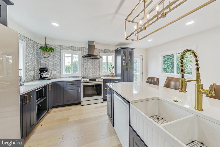 Step inside this fully updated, one-of-a-kind Cape Code in the heart of Bowie! Every detail was meticulously thought out, from the gourmet kitchen, to the brand-new dormers. What was supposed to be the seller’s forever home can now be your next beautiful adventure. Let their loss be your gain! The welcoming front porch leads you into an expansive main level that was upgraded from floor to ceiling. The bright and spacious living room includes brand new recessed lighting and a beautiful accent wall with a built-in electric fireplace. The remodeled kitchen addition includes a large island, all wood cabinetry, quartz countertops, upgraded appliances and an adjacent dining area. Down the hall is a brand-new half bath and the large primary bedroom complete with an ensuite with a soaking tub and large marble-top vanity. Upstairs, the traditional Bowie Cape Cod was upgraded with a full bathroom remodel, including a walk-in shower with marble countertop vanity, and the addition of dormers in each bedroom for additional space and lighting. Through the kitchen, you will find a fully fenced in backyard with a brand-new deck, pergola, and firepit, perfect for entertaining! Almost every inch of this home was updated including hardwood throughout, fresh paint inside and out, new front porch decking, and updated electrical. Even the garage received a face-lift! The roof, windows, exterior doors, and water heater are all less than 10 years old and the HVAC was replaced in 2012. Conveniently located close to shopping, restaurants, and major commuter routes to Washington D.C., Northern Virginia, Baltimore, and major military installations, this home will impress evening the pickiest of buyers! Schedule your private showing today!